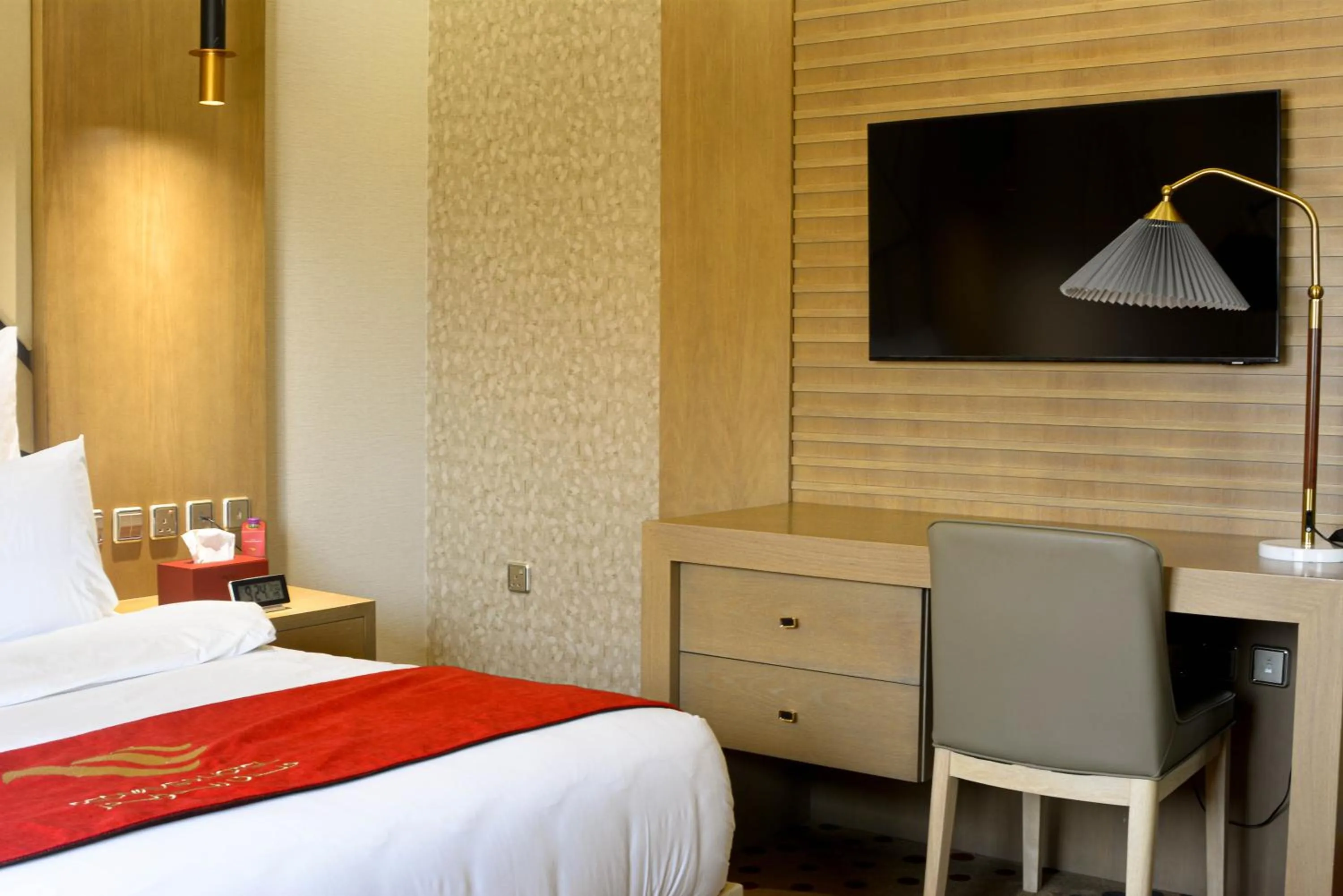 Bed in Redwaves Hotel