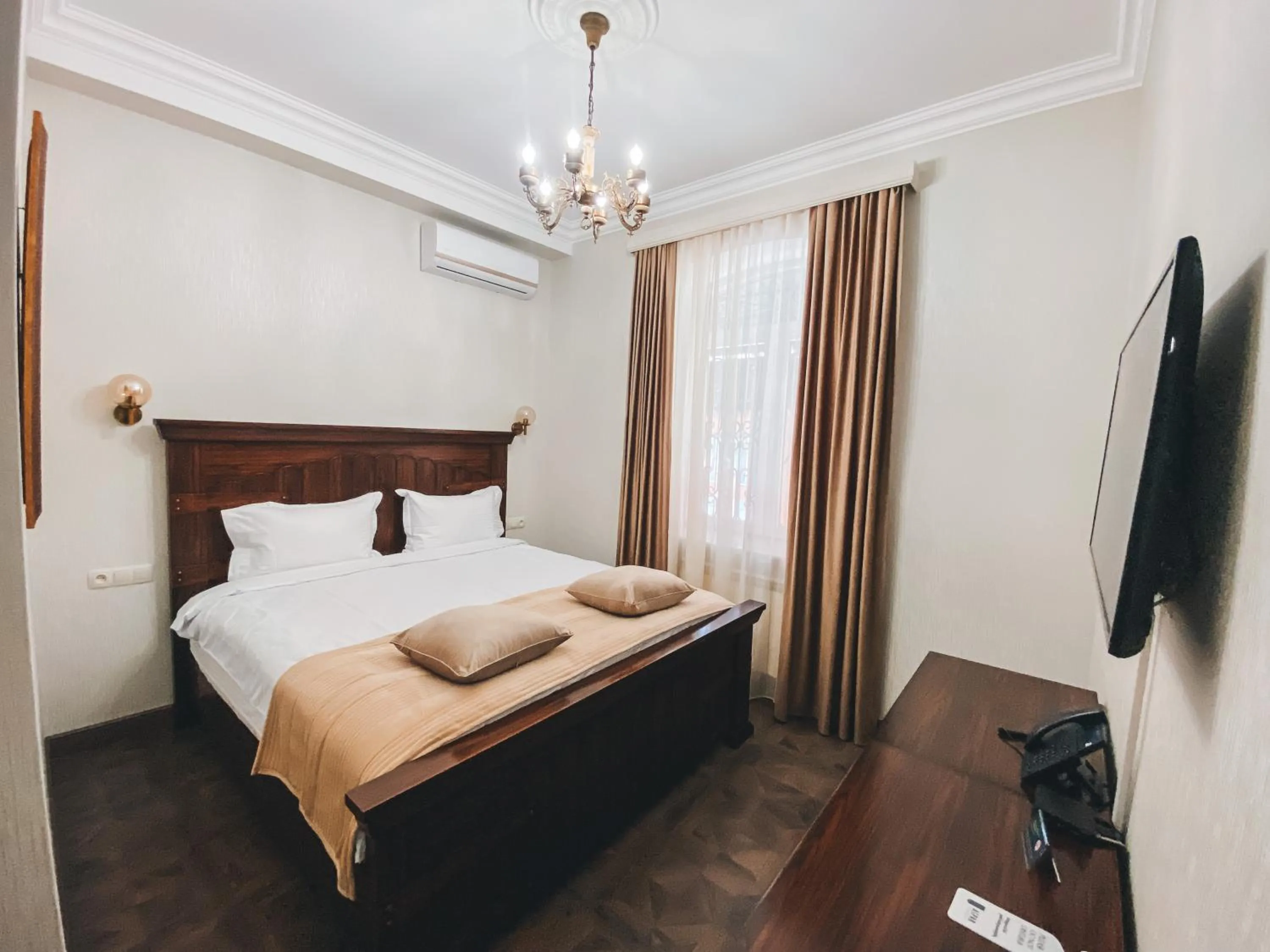 Communal lounge/ TV room, Bed in Aspar Boutique Hotel