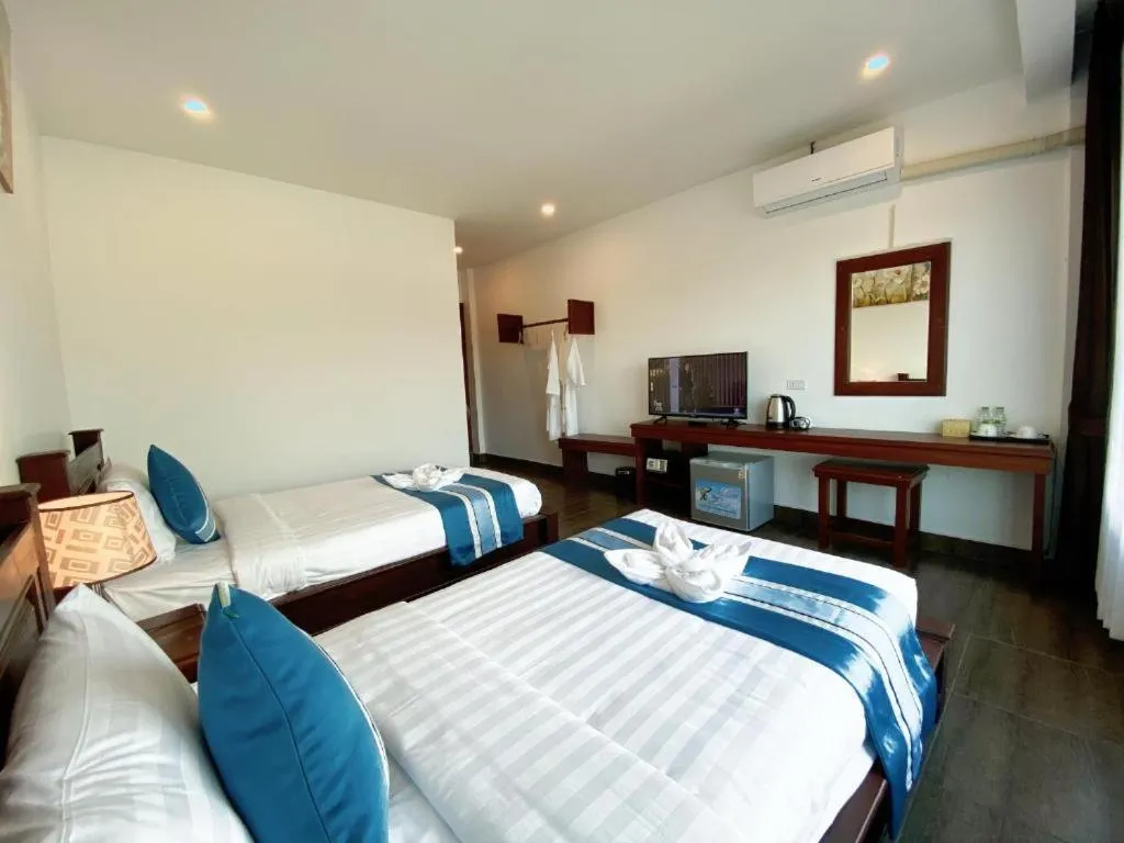 Bed in VANG VIENG TOPVIEW HOTEL