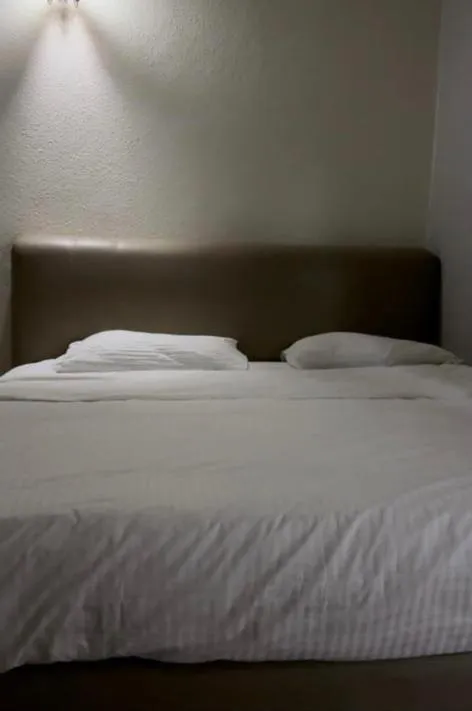 Bed in G99 Hotel