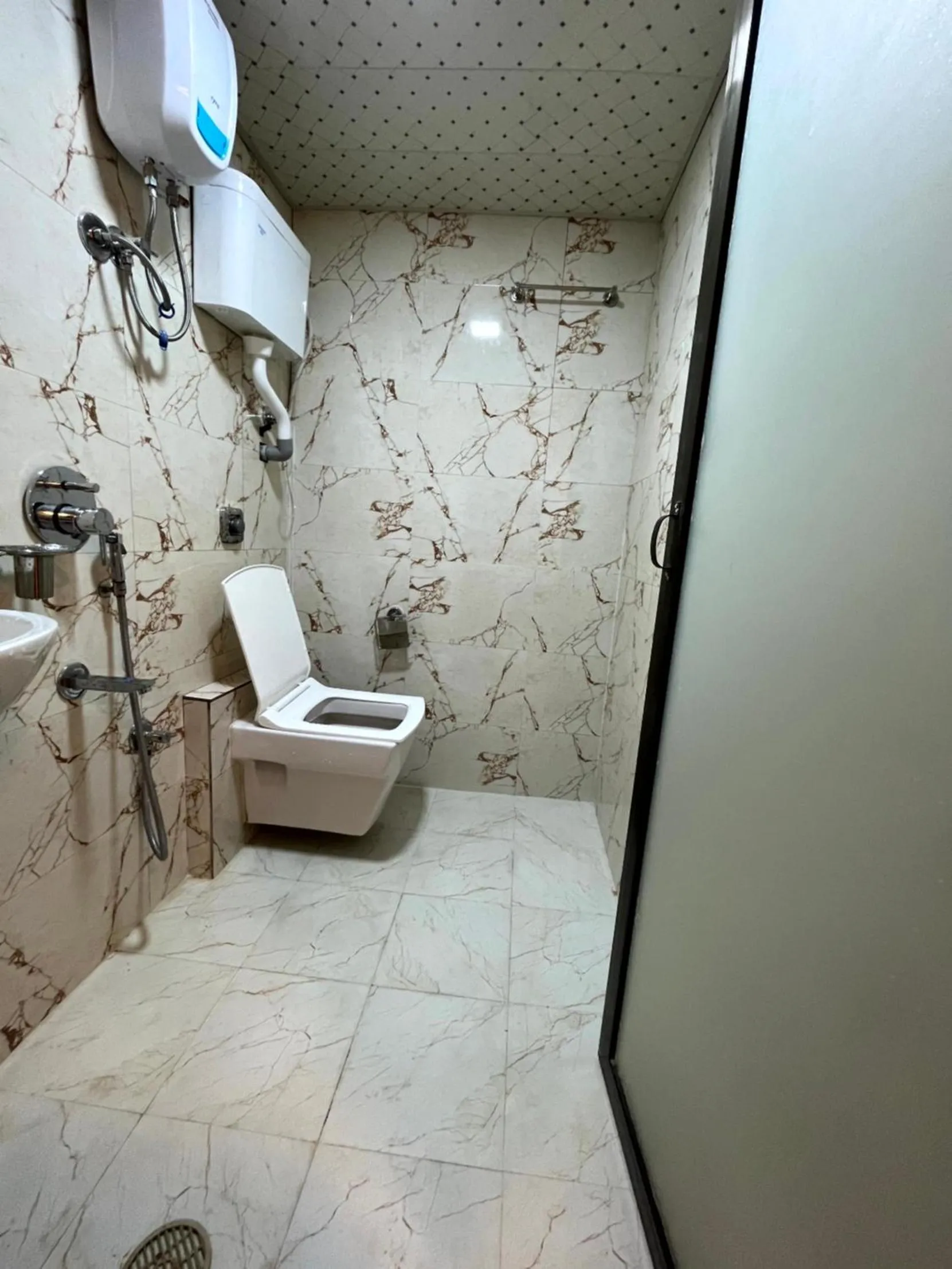 Toilet in Hotel Delmond Prime- Near NESCO