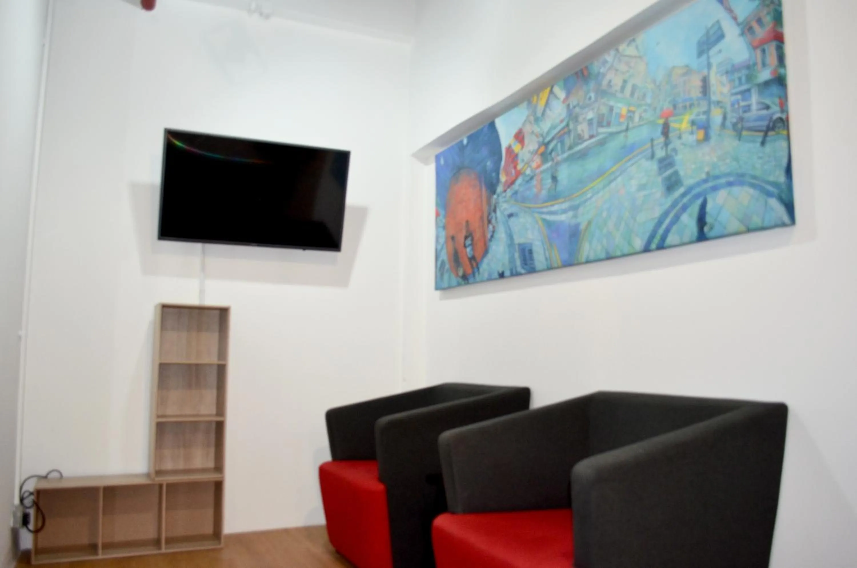 Communal lounge/ TV room in RED ROOM Kuala Lumpur