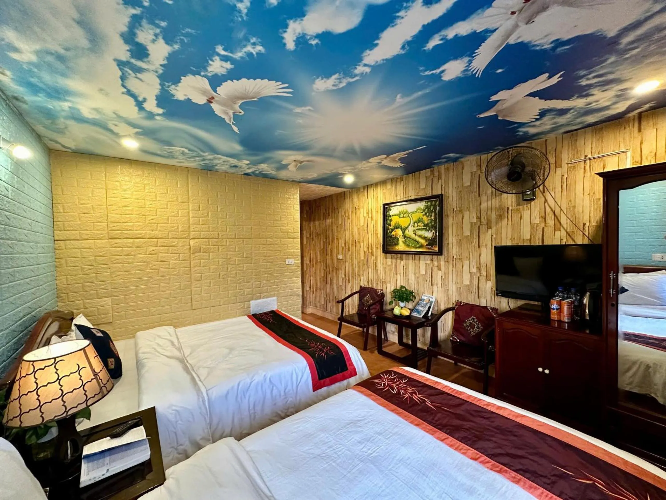 Communal lounge/ TV room, Bed in Hà Giang Hotel Sapa