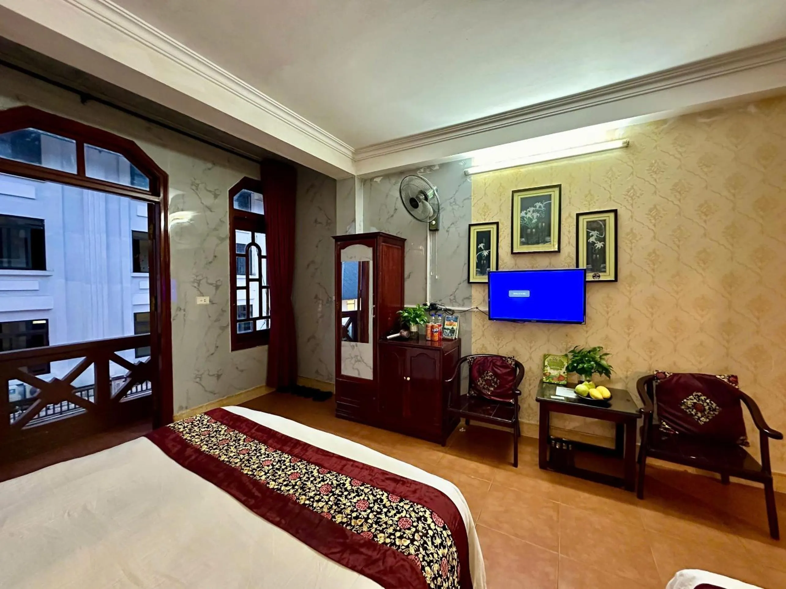 Communal lounge/ TV room, Bed in Hà Giang Hotel Sapa