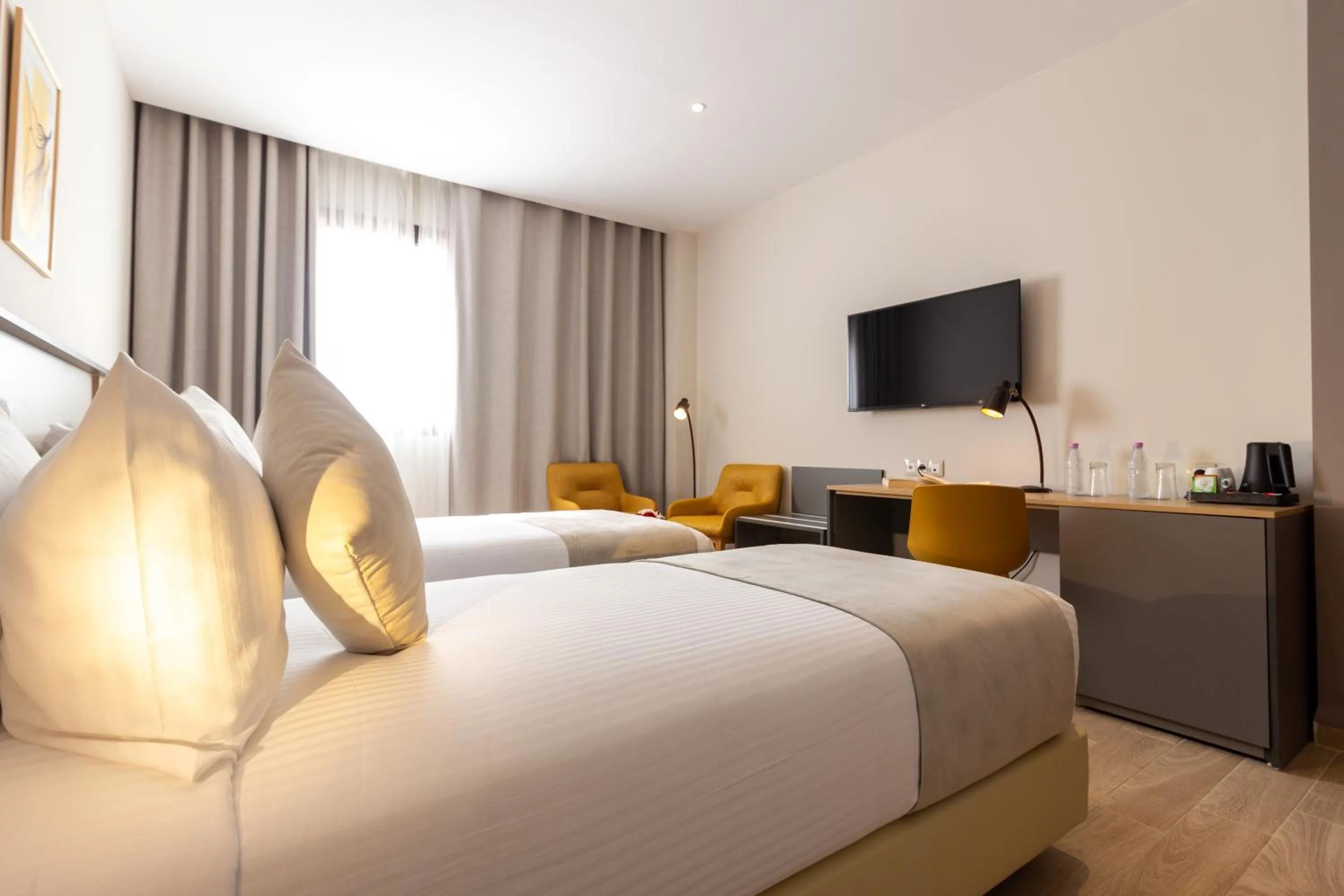 Communal lounge/ TV room, Bed in Golden Tulip Opera Alger