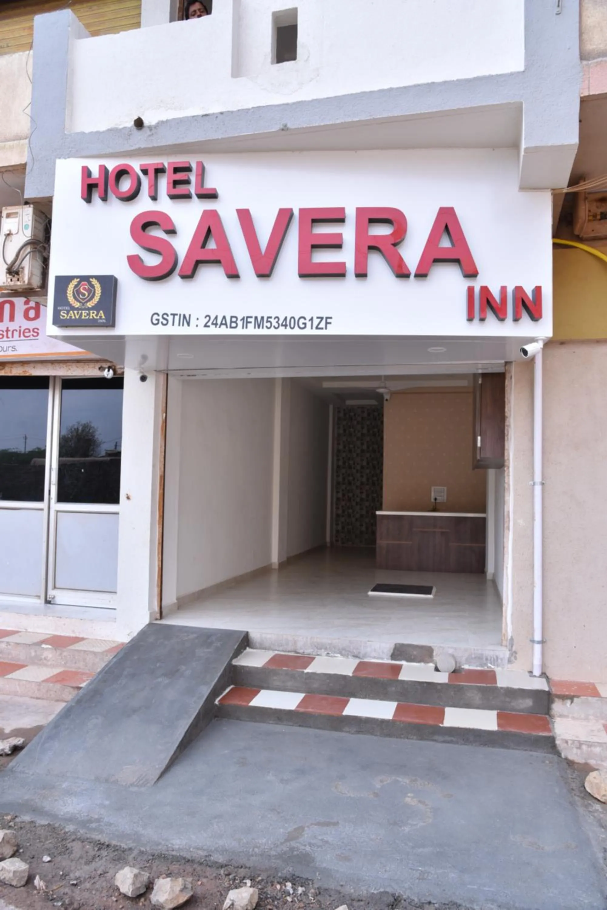 Logo/Certificate/Sign in Hotel Savera Inn
