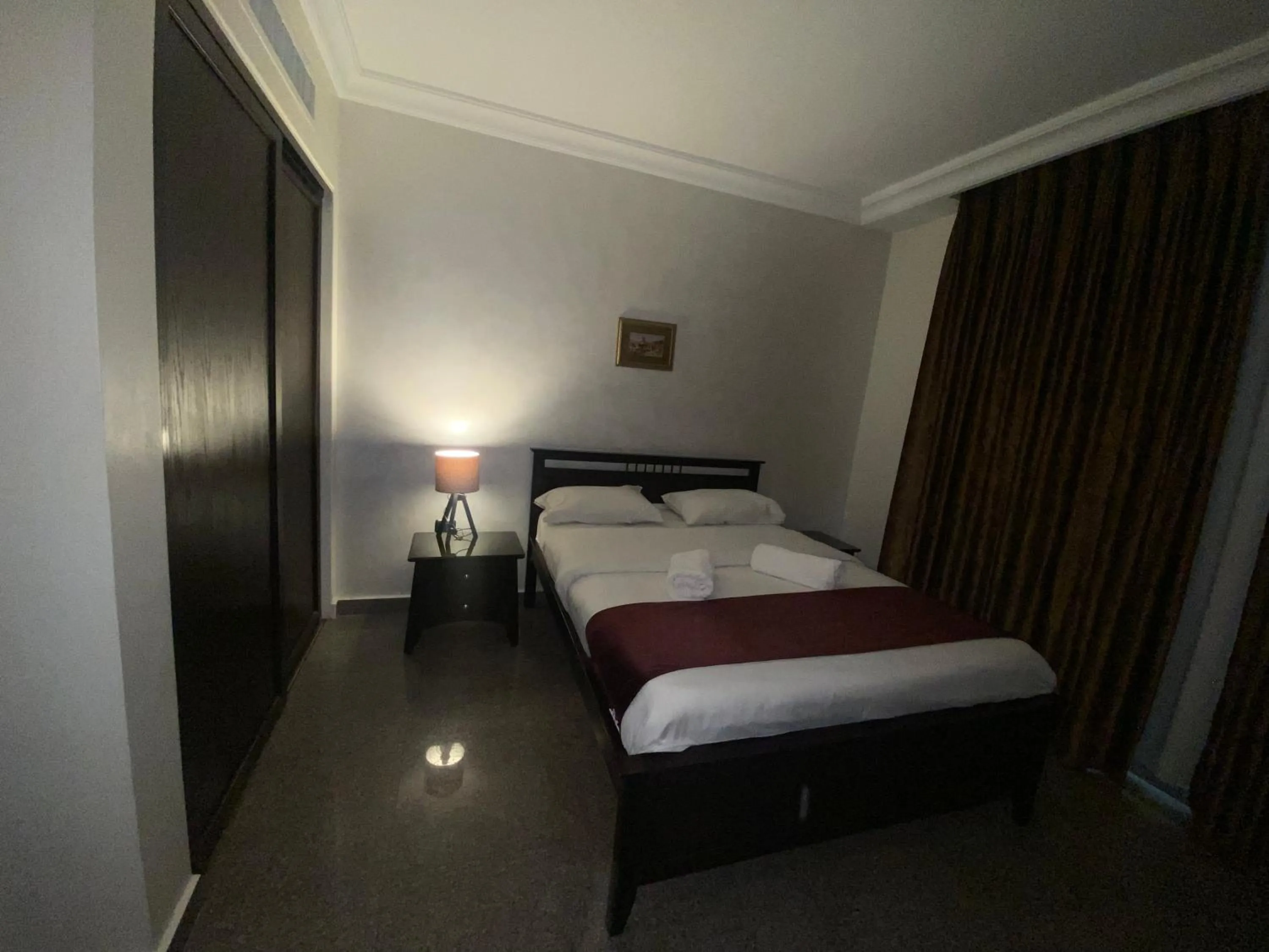 Bed in Tamrah Suites Hotel