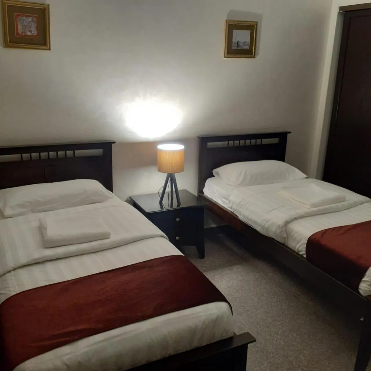 Bed in Tamrah Suites Hotel