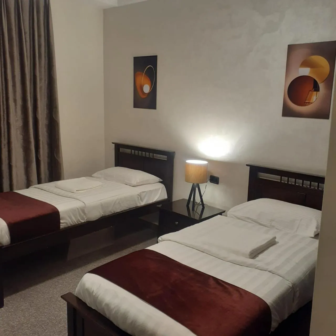 Bed in Tamrah Suites Hotel