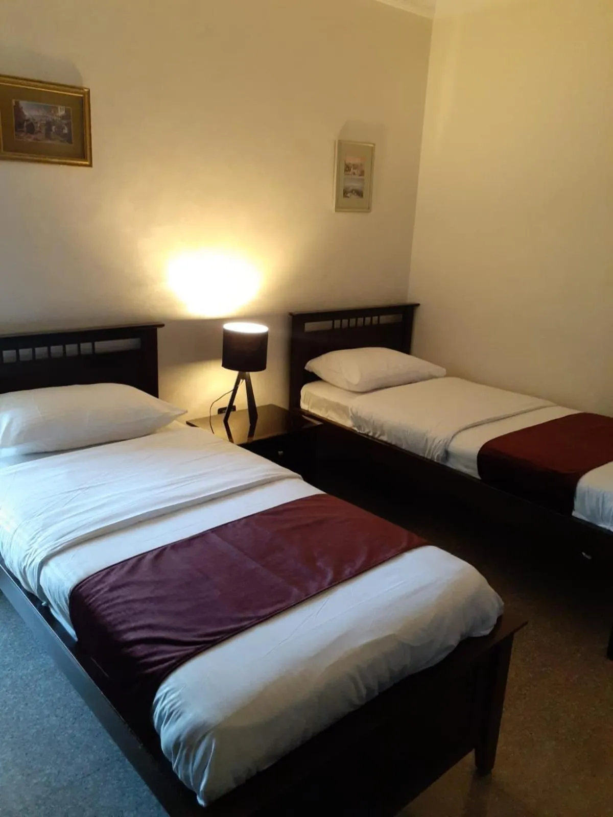 Bed in Tamrah Suites Hotel