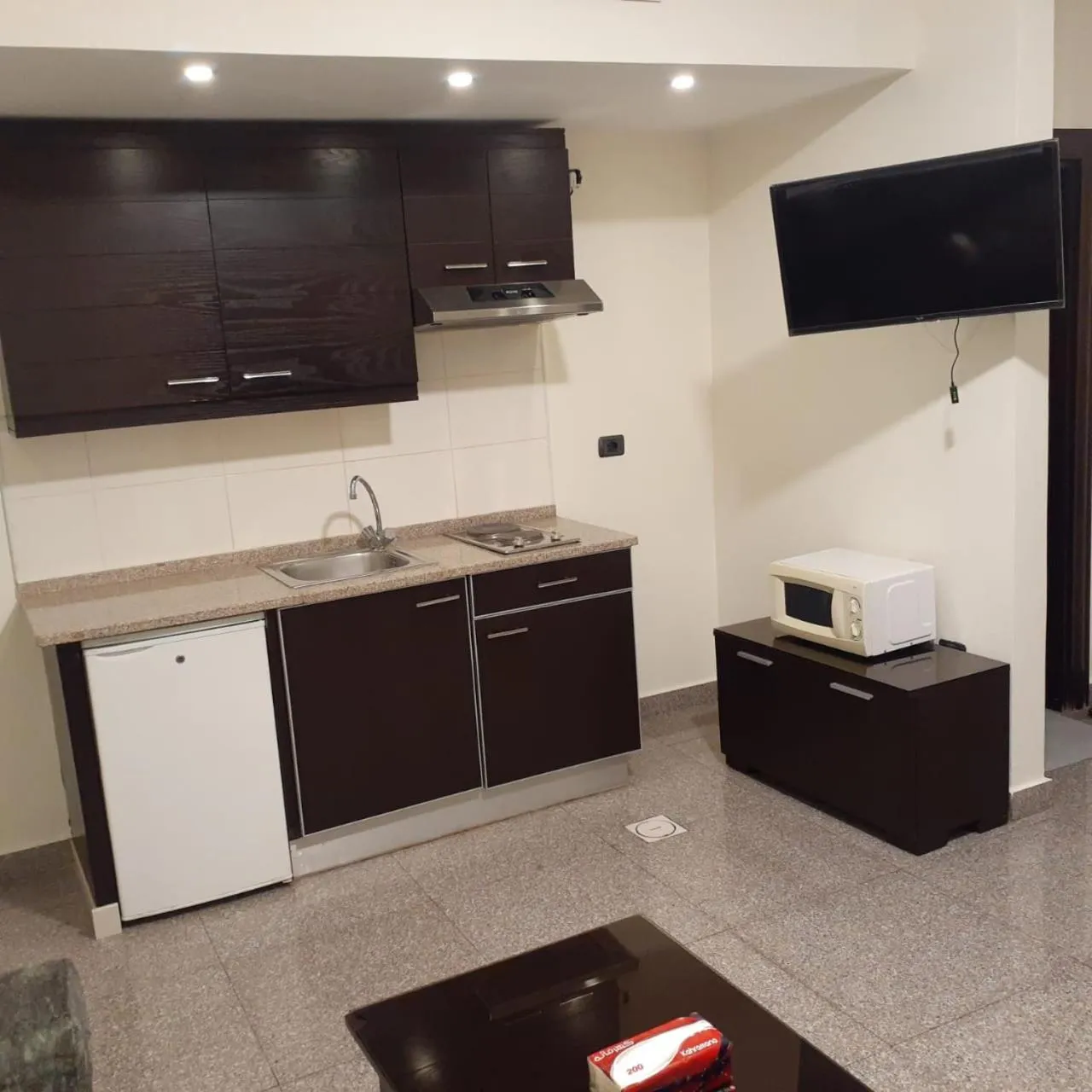 Kitchen or kitchenette in Tamrah Suites Hotel