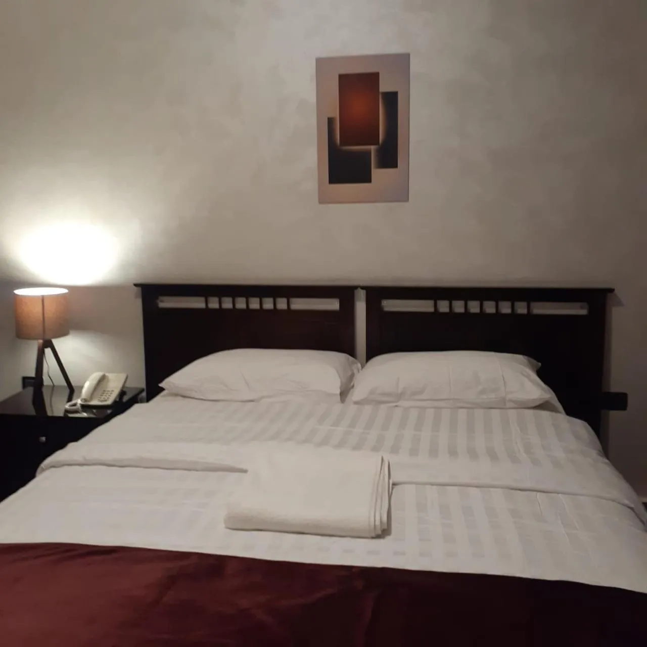 Bed in Tamrah Suites Hotel