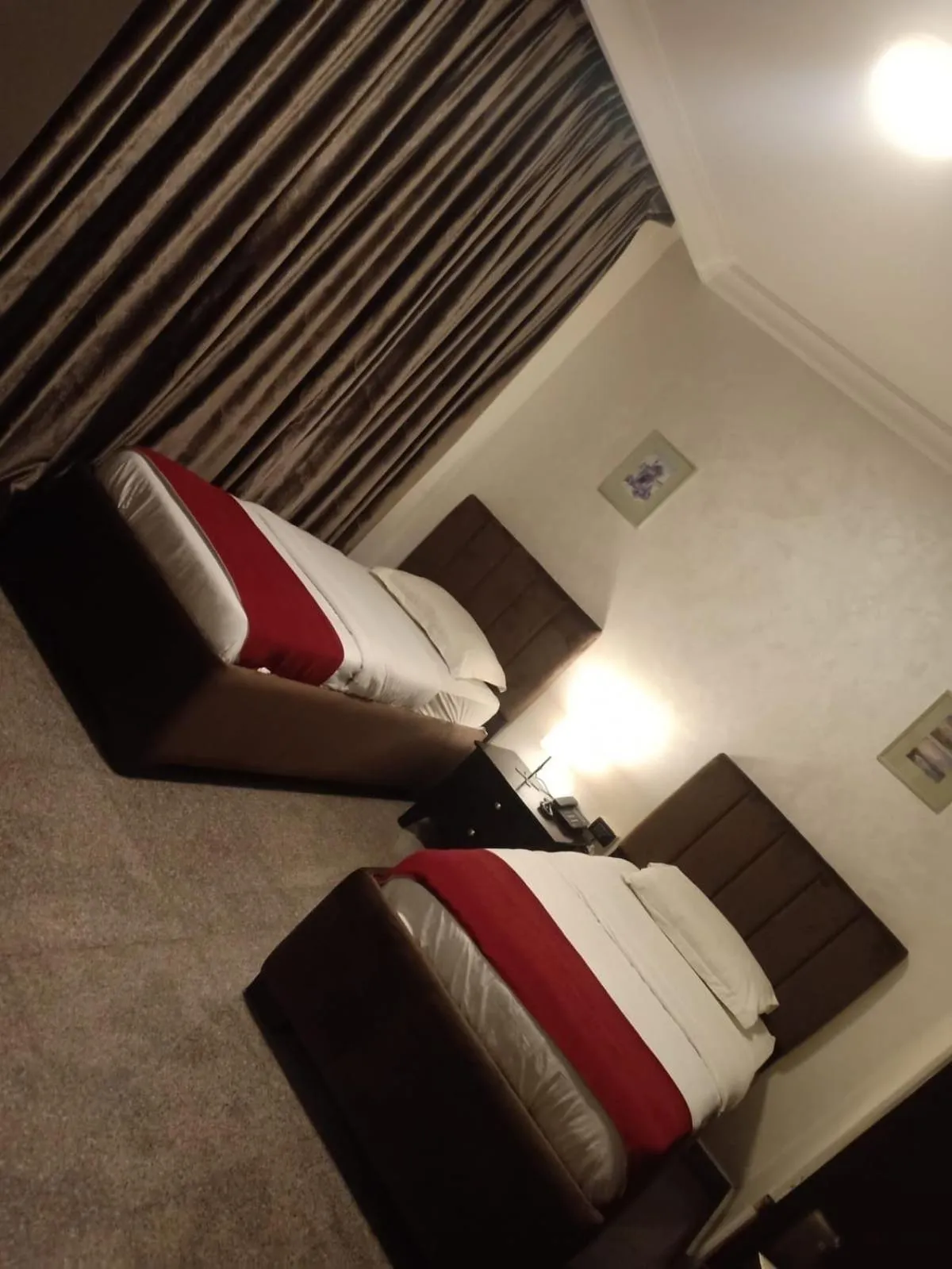 Bed in Tamrah Suites Hotel