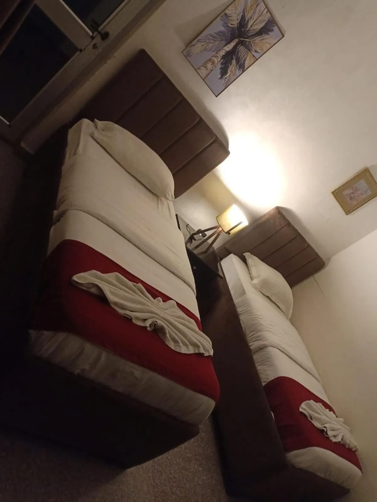 Bed in Tamrah Suites Hotel