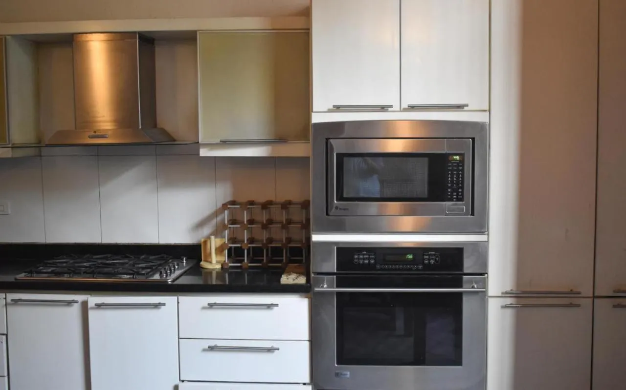 Kitchen or kitchenette in Casa Gaitana - Alma Hotels