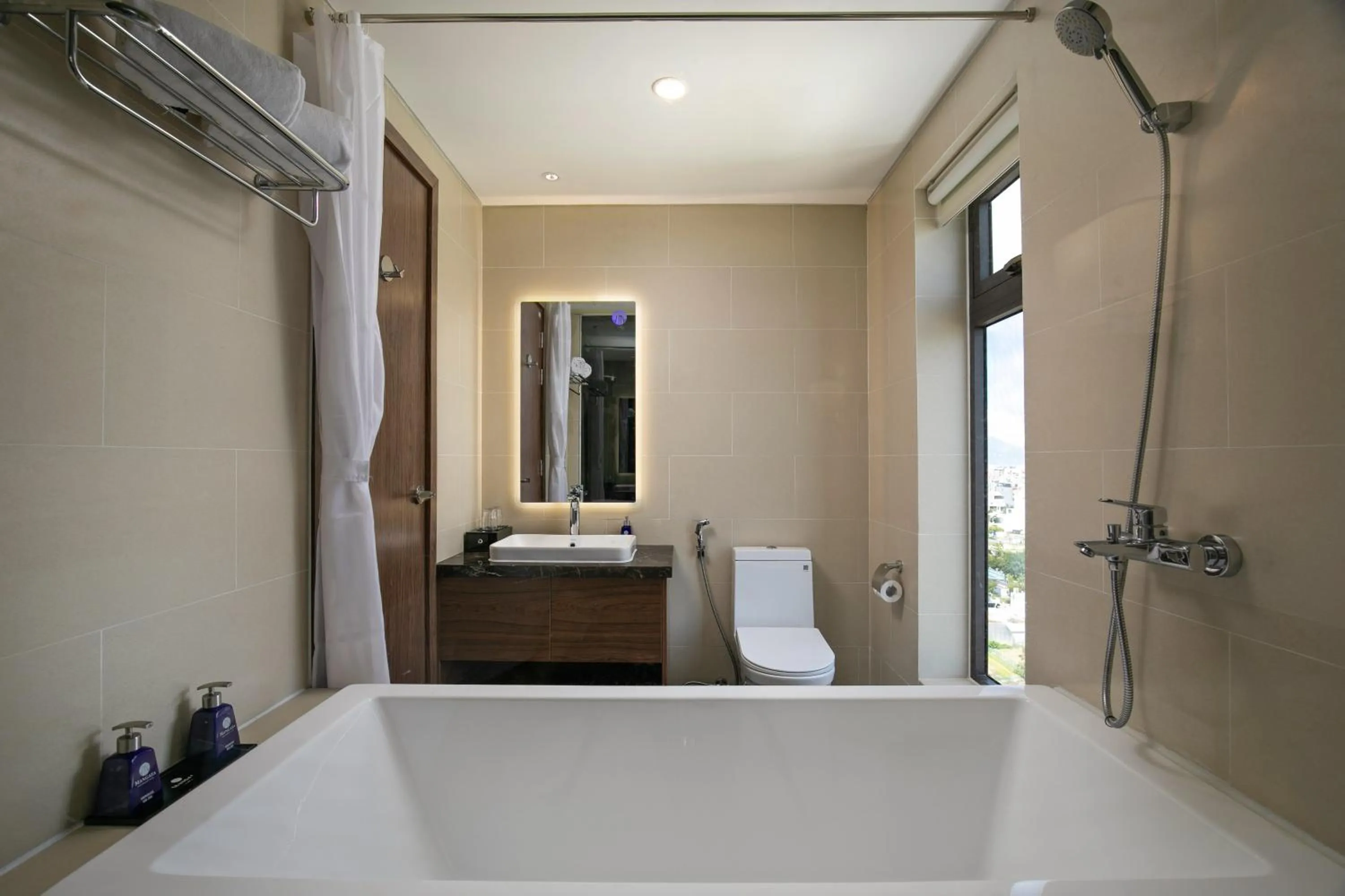 Bathroom in Mangata Beachfront Hotel - Rooftop Bar Sea View