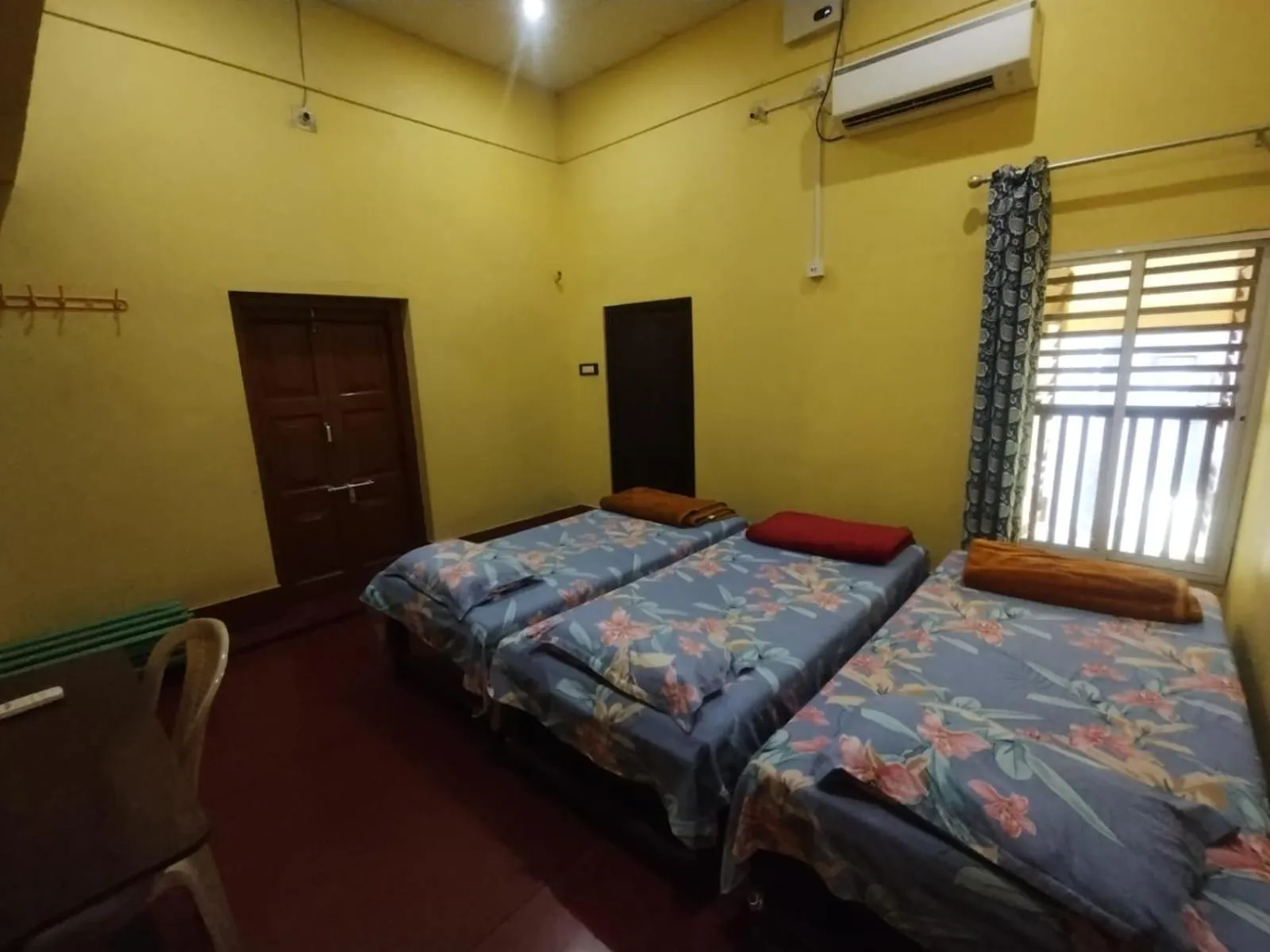 Photo of the whole room, Bed in Bequest Stays In Puri