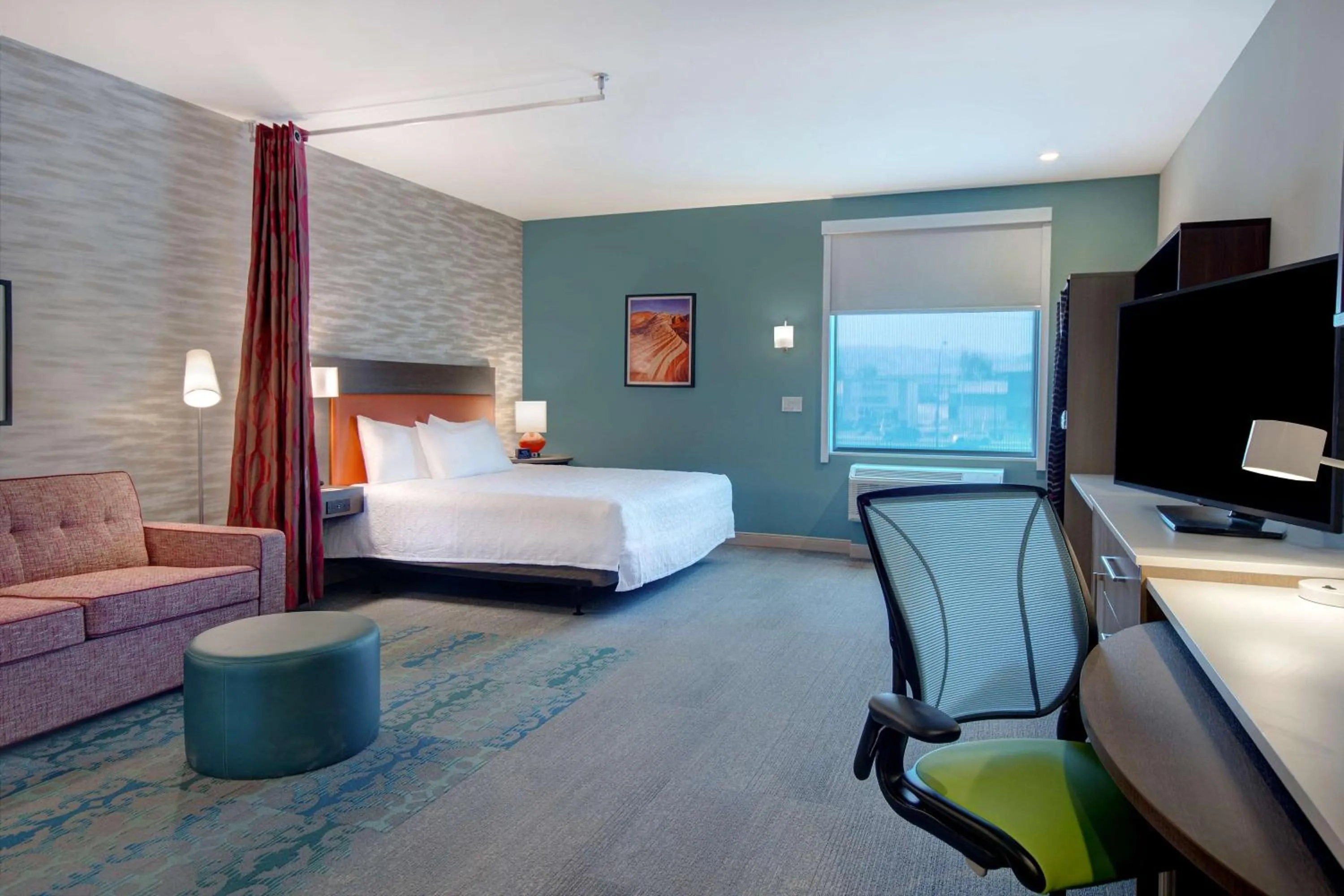 Living room, Bed in Home2 Suites By Hilton Las Vegas North