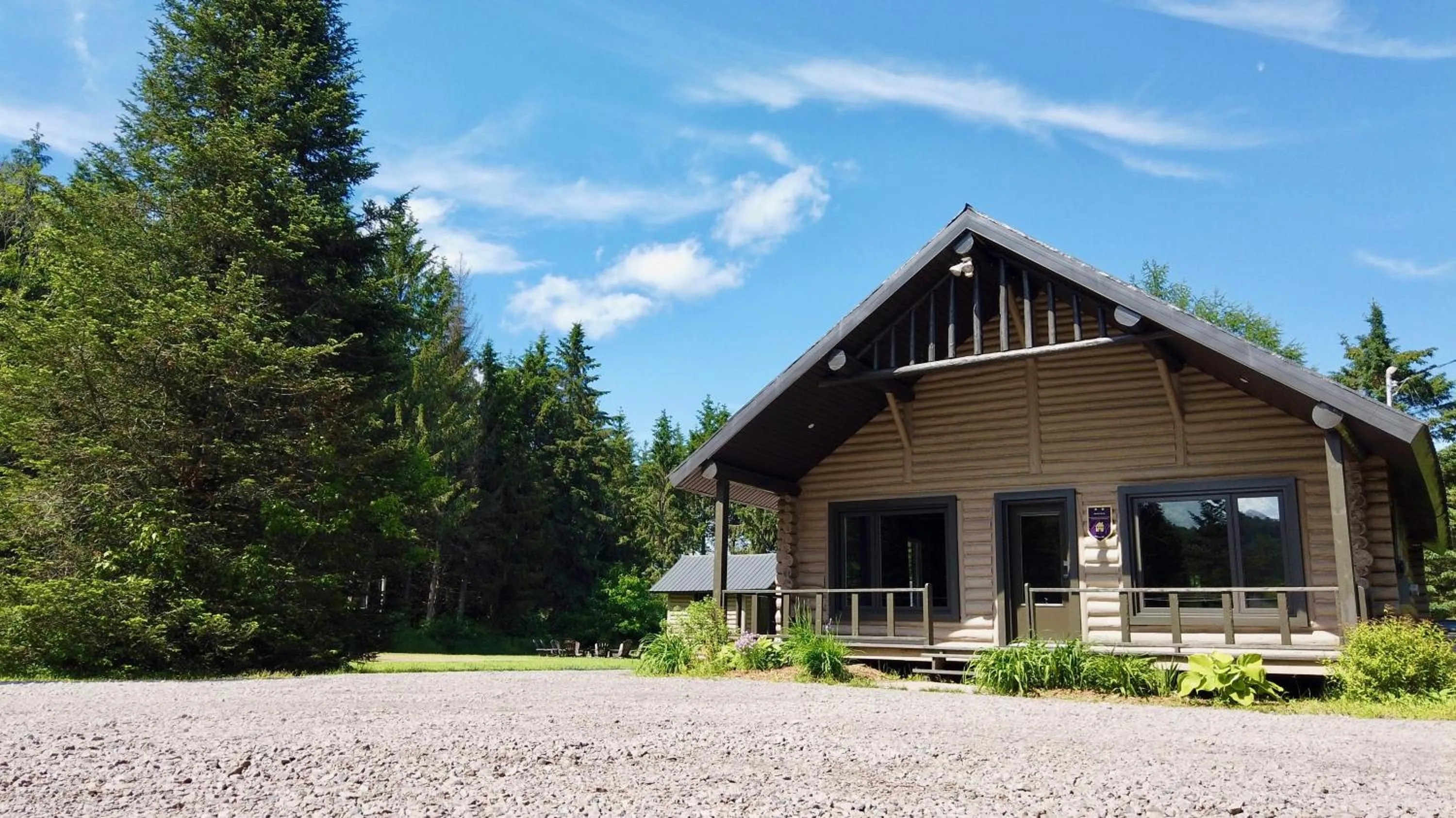 Property building in Les Chalets Tourisma - Chalet en bois rond avec spa - Chalet du 4e