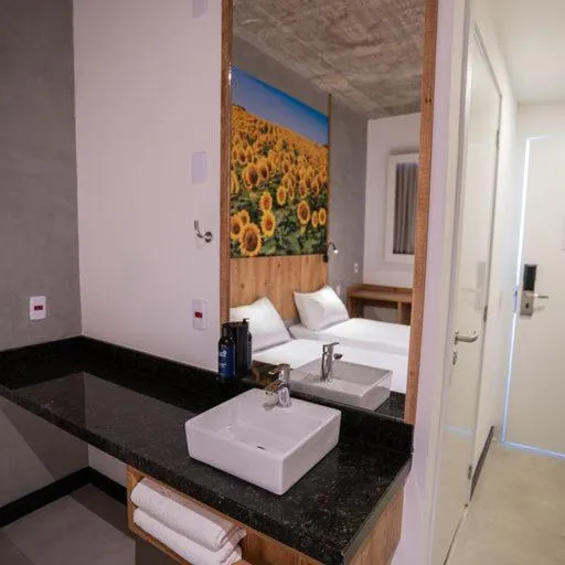 Photo of the whole room, Bed in CAMPOS DE HOLAMBRA INN