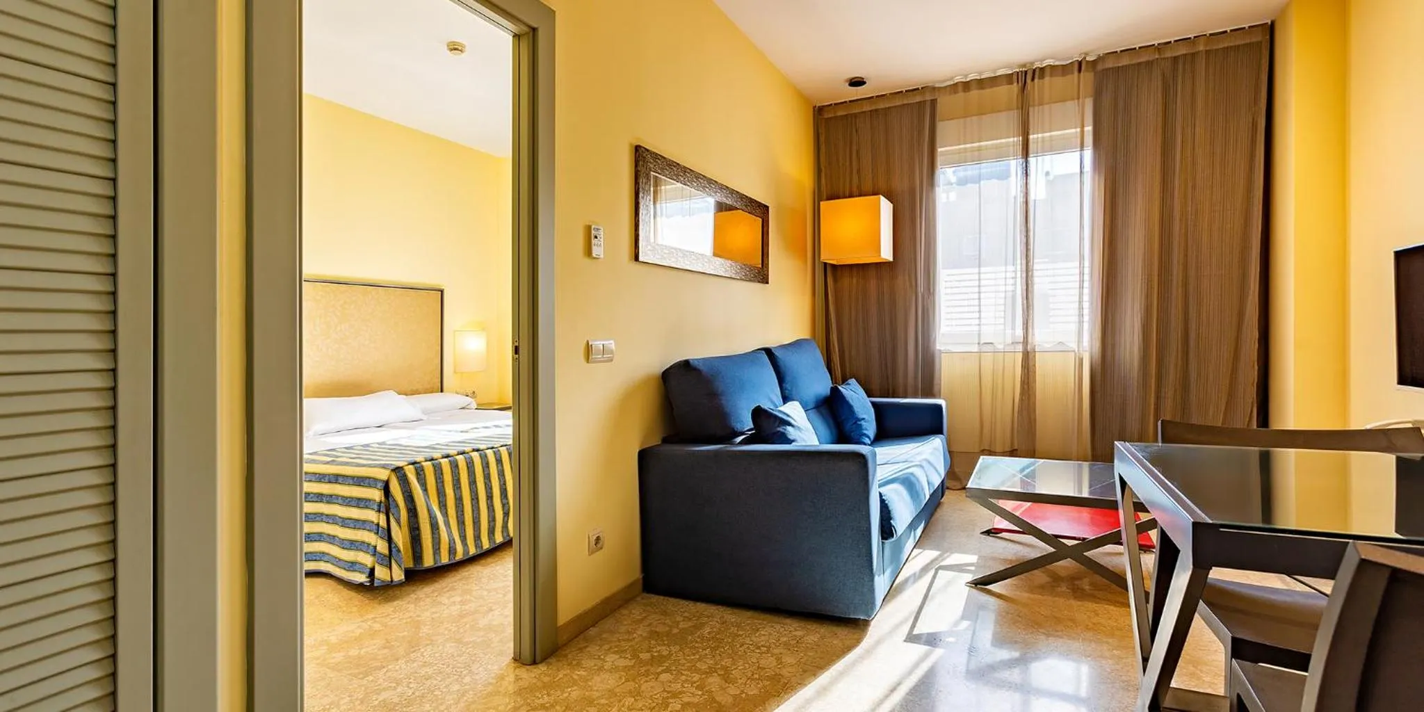 Living room, Bed in Apartamentos Vértice Sevilla Aljarafe