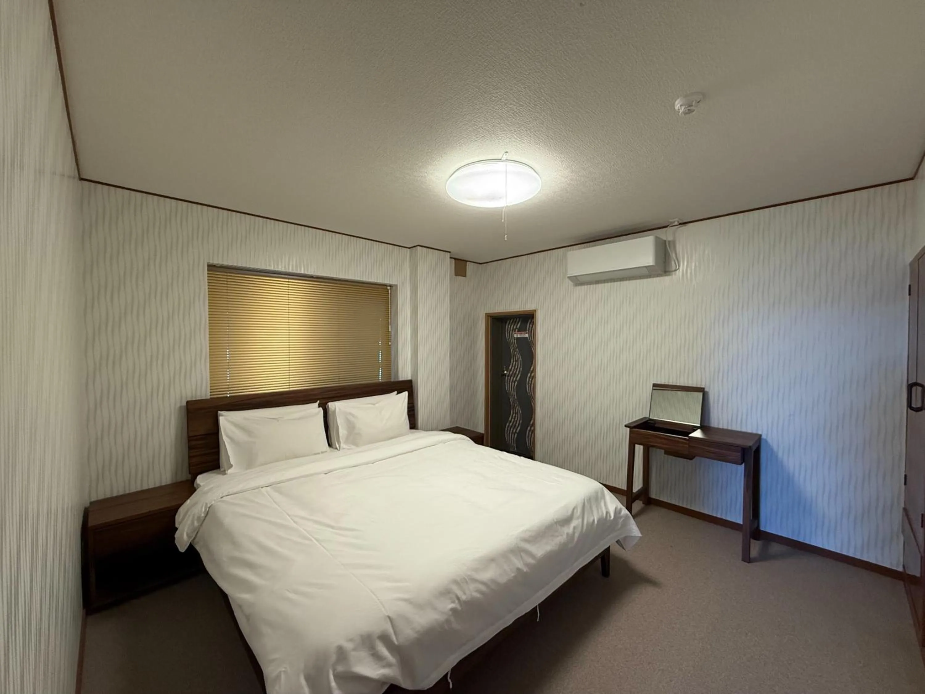 Bed in HOTEL COCOA RESORT