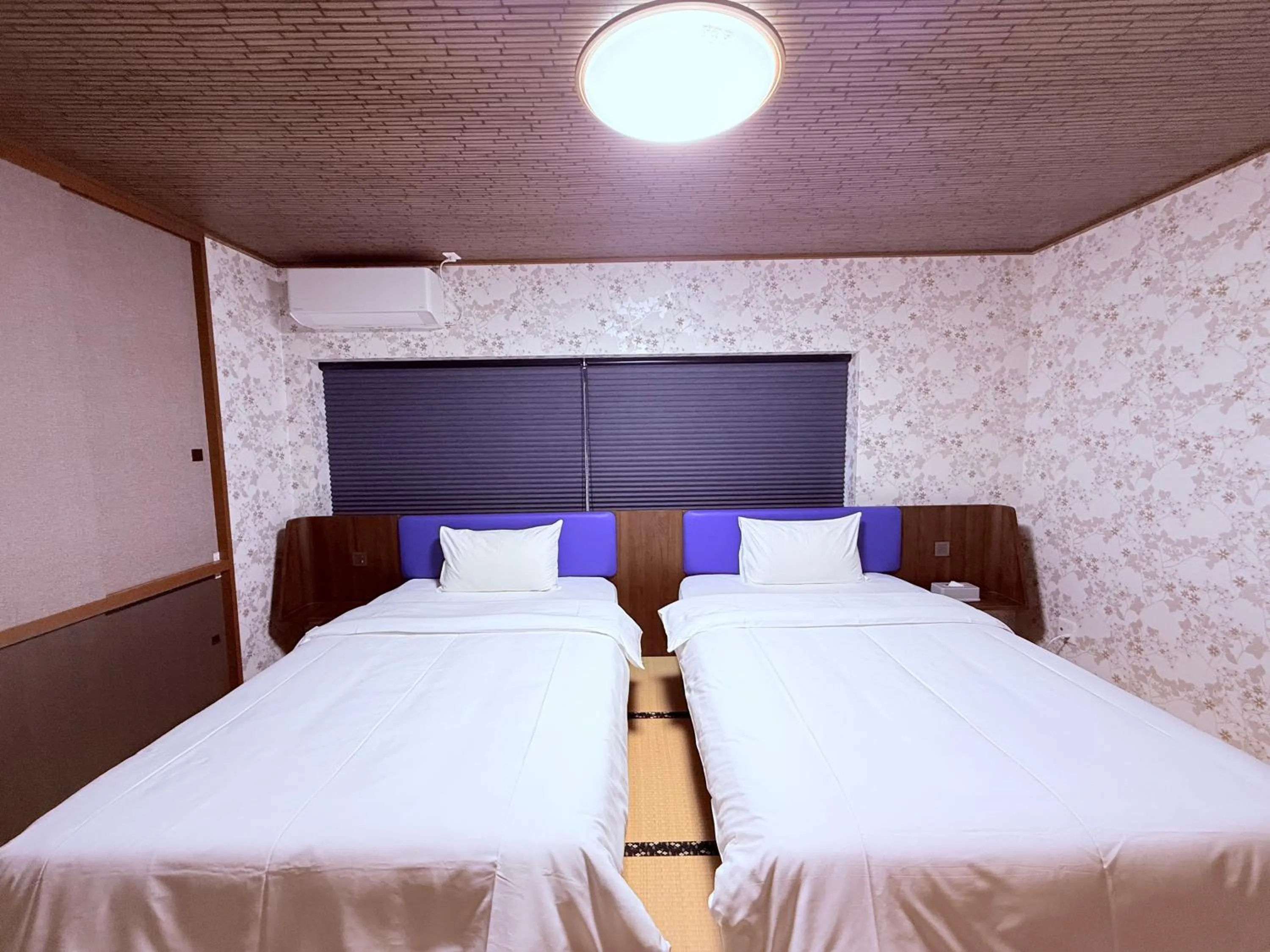 Bed in HOTEL COCOA RESORT