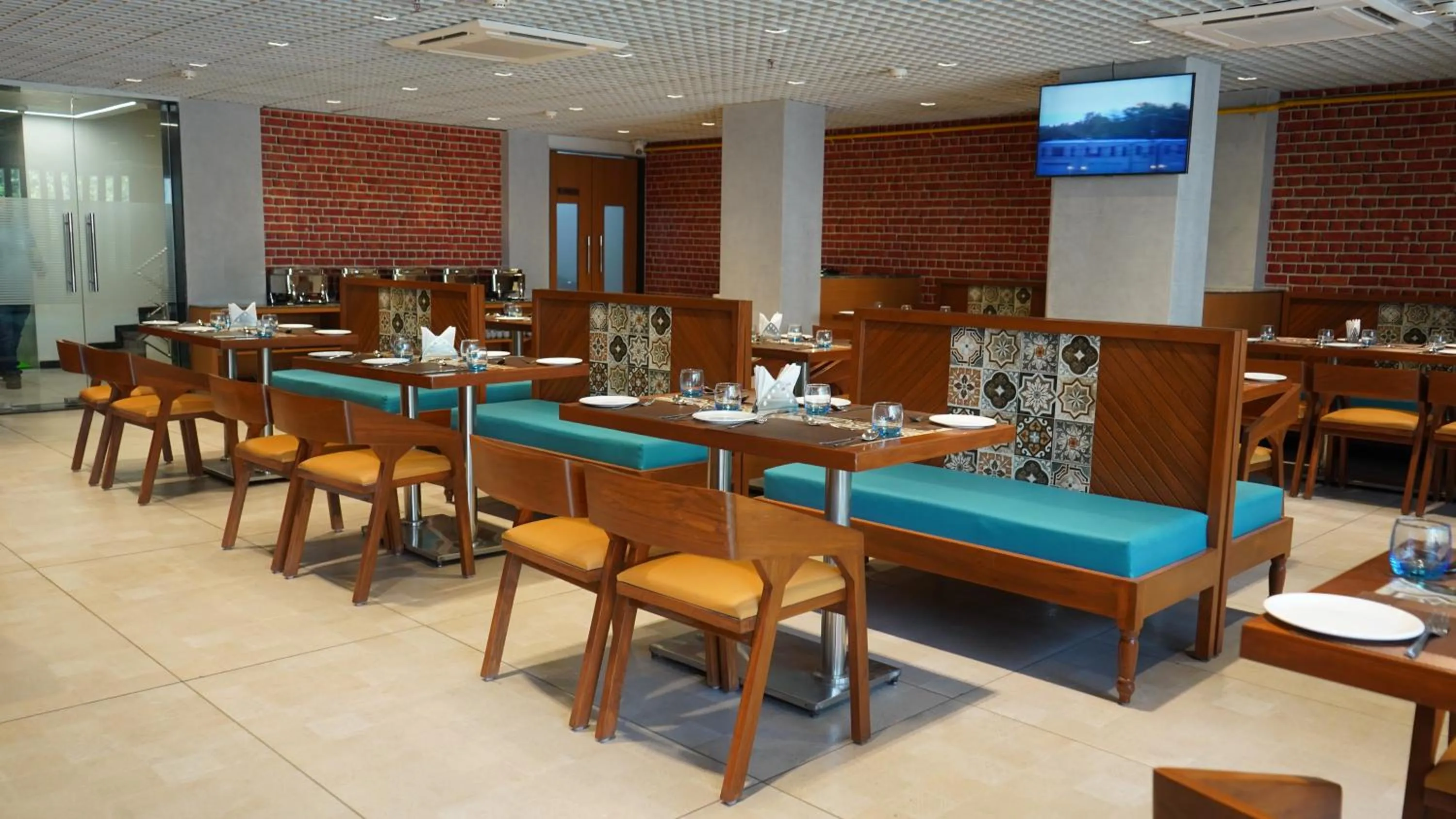 Dining area in Purple Beds by VITS Dwarkesh, Surat