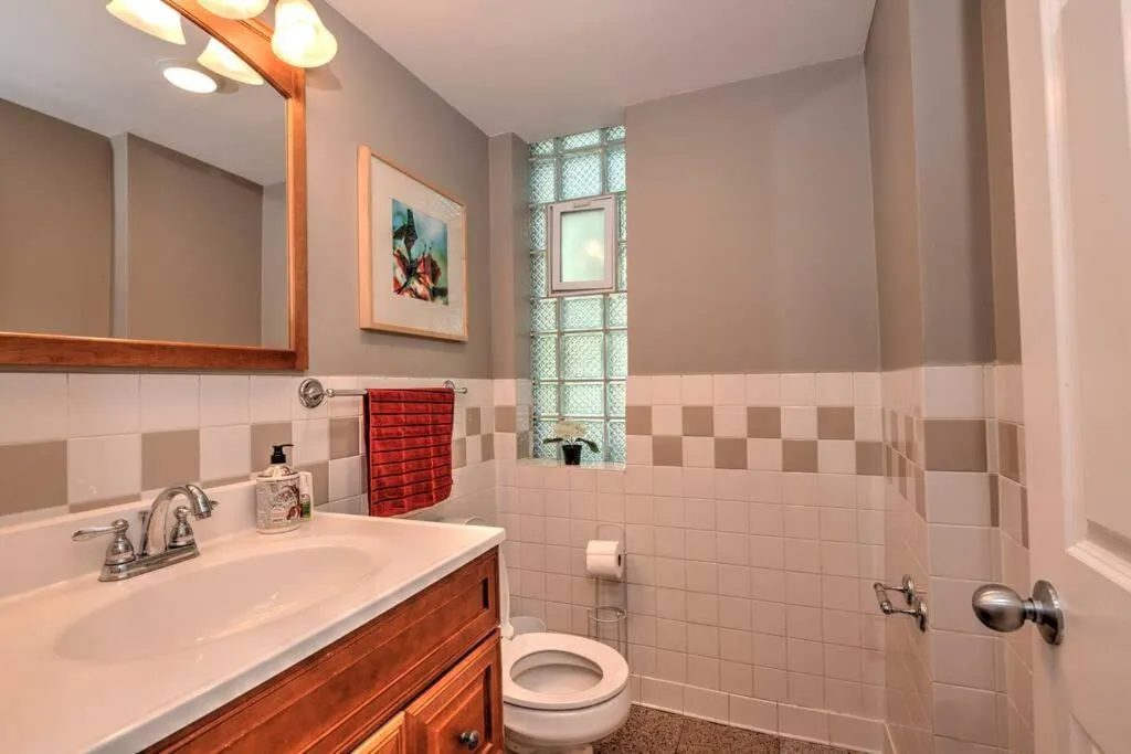 Bathroom in Spacious Row Home next Transit near Downtown w Parking