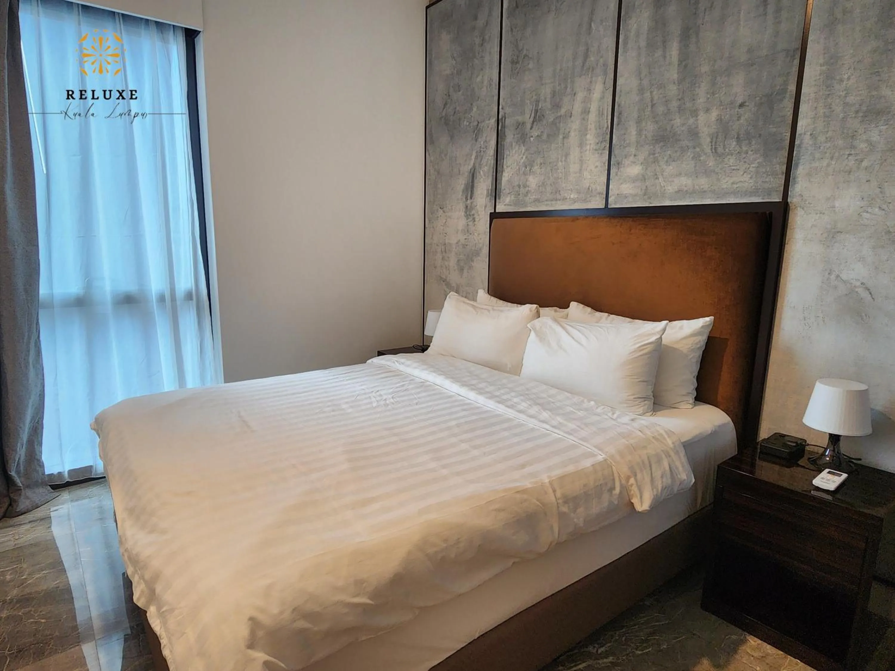 Bed in The Platinum 2 Premium Suite by Reluxe