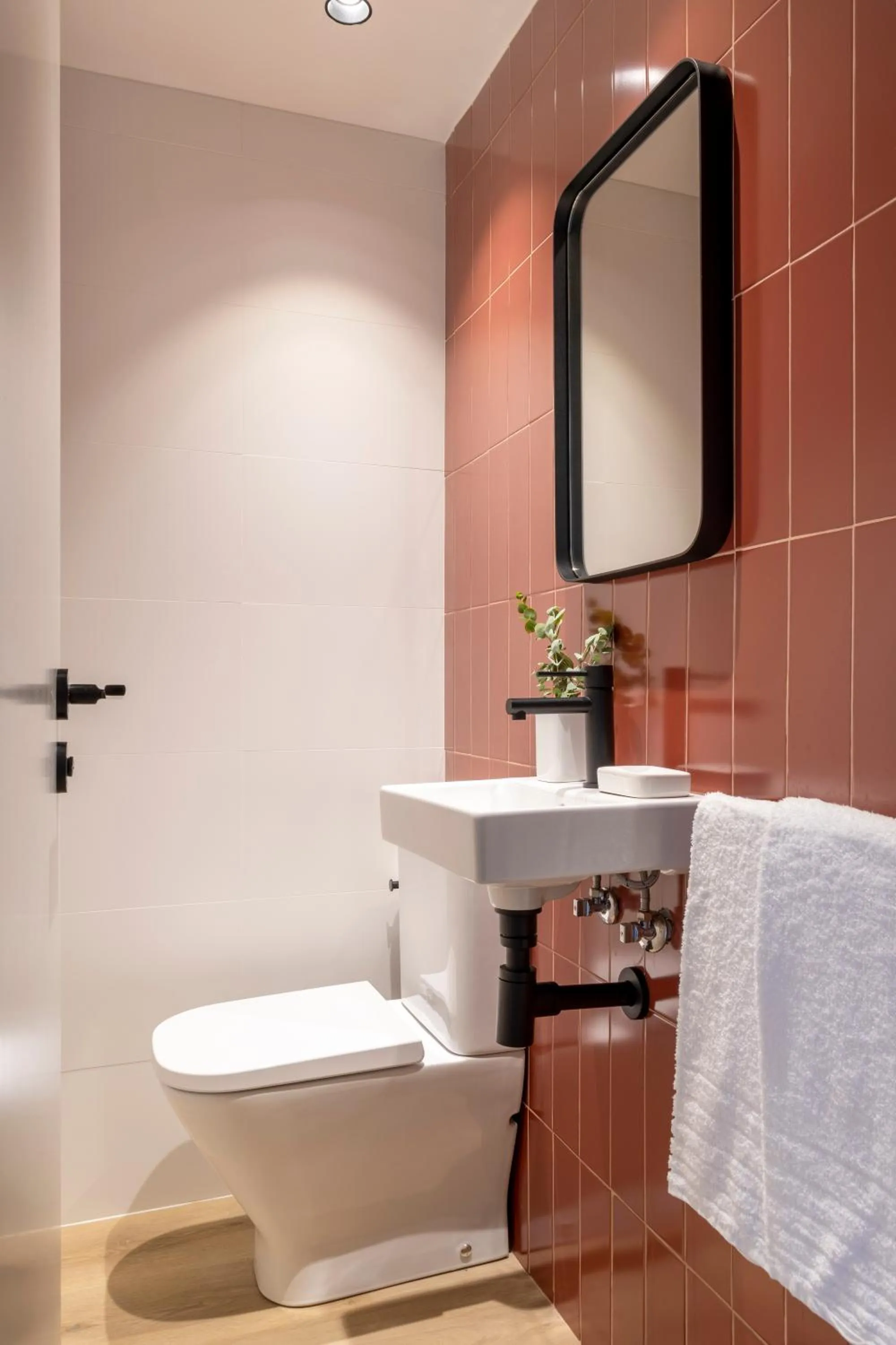 Toilet in Arrivo Apartments