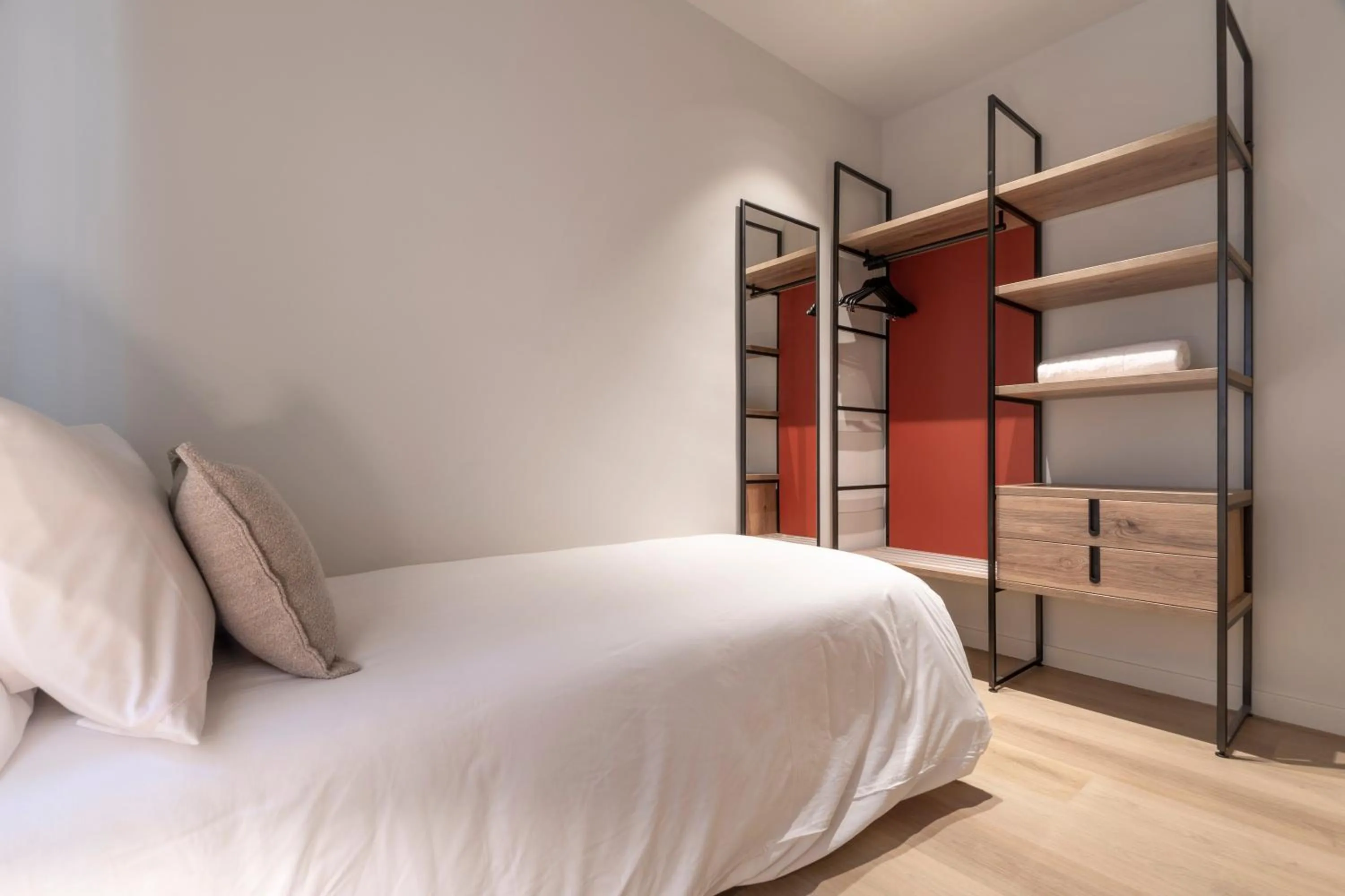 Bed in Arrivo Apartments