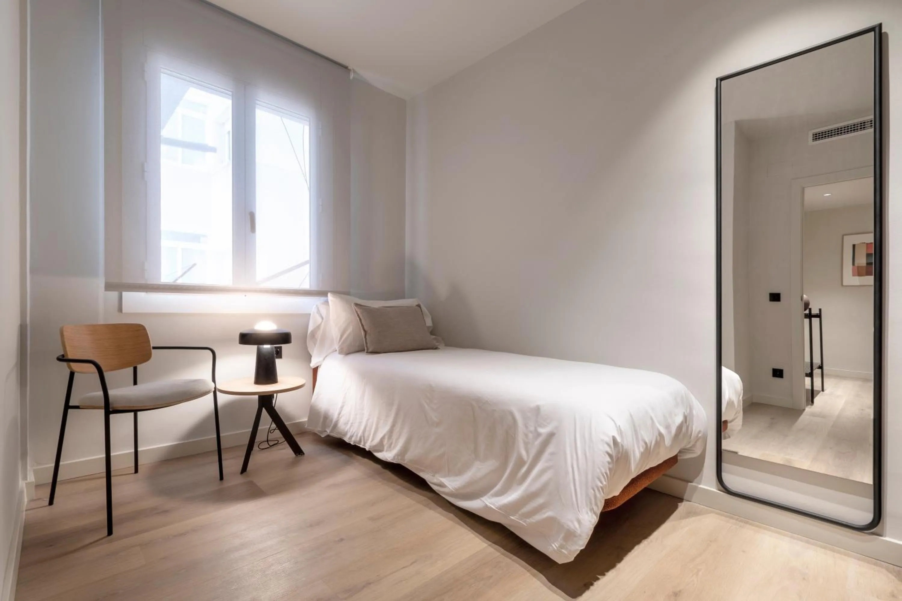 Bed in Arrivo Apartments