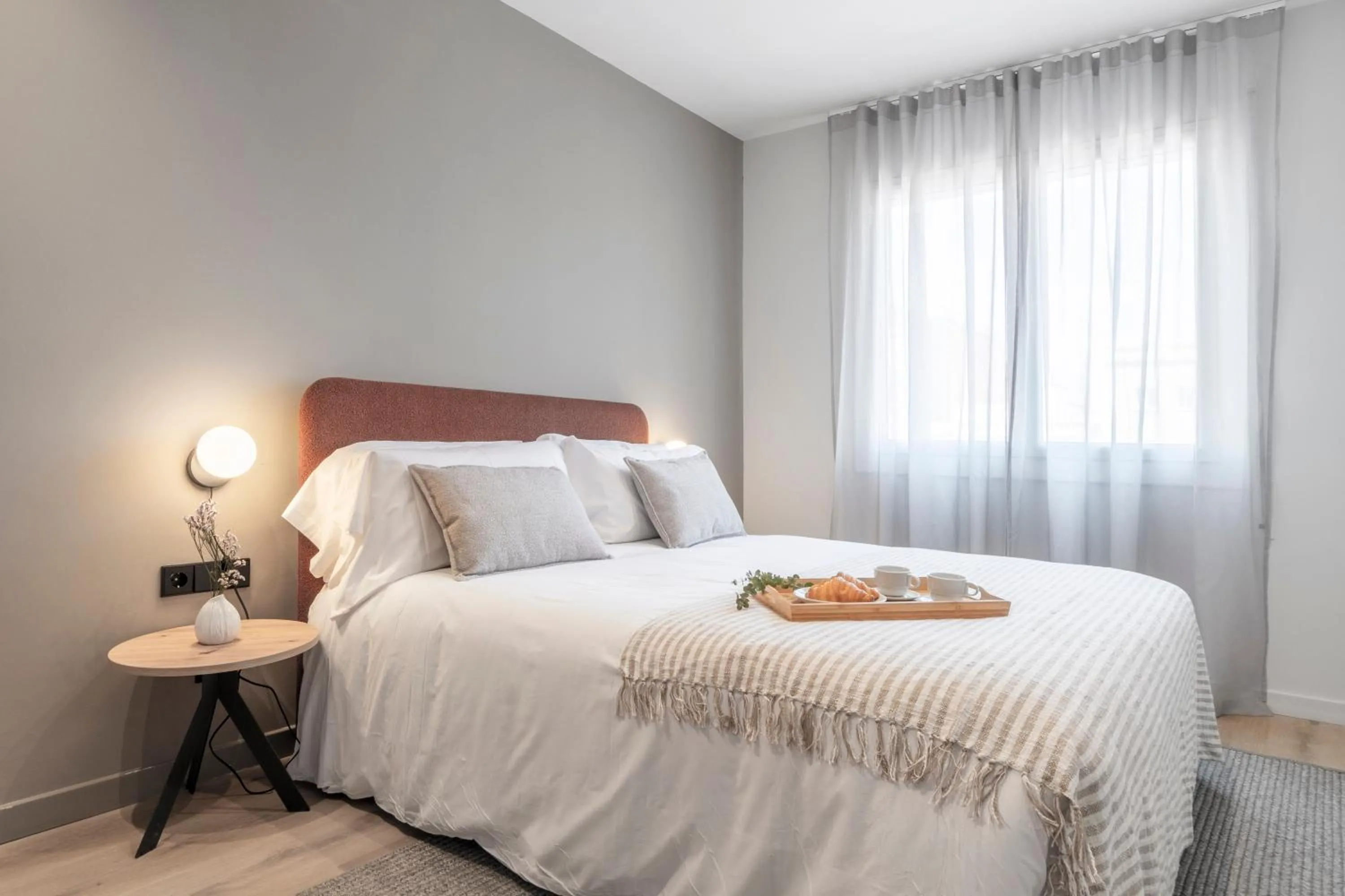 Bed in Arrivo Apartments