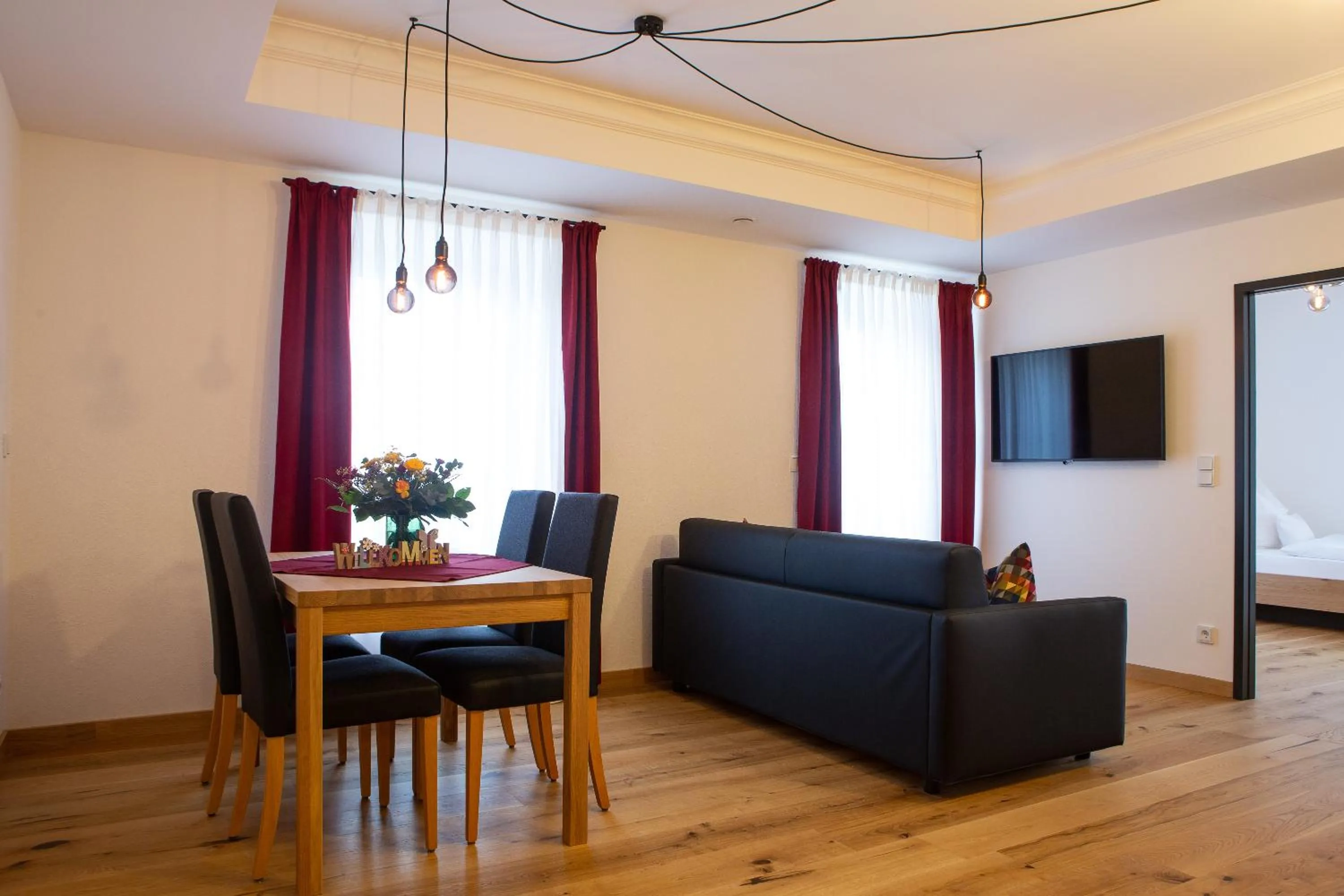 Communal lounge/ TV room in Gasthof & Hotel Bichler