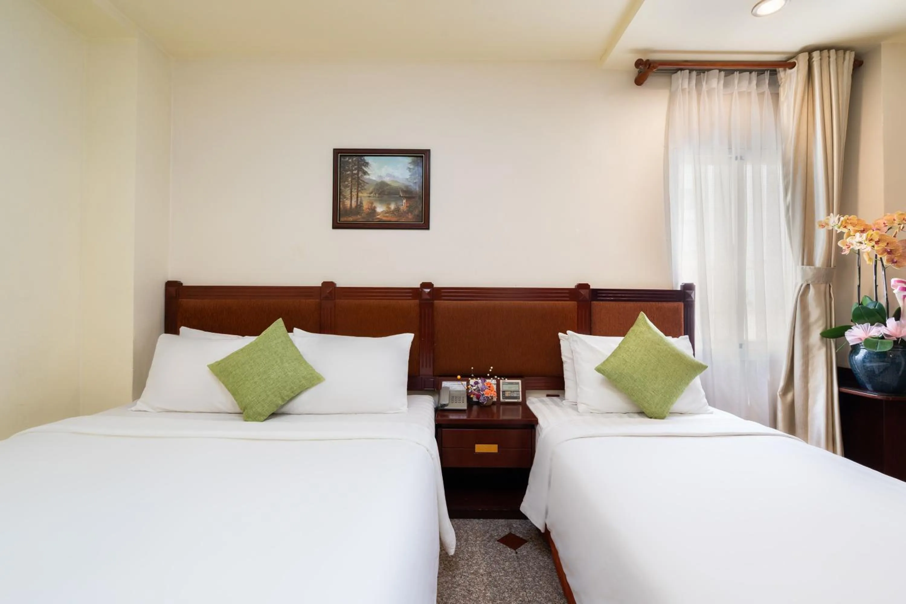 Bed in LUCASTA SAIGON Hotel