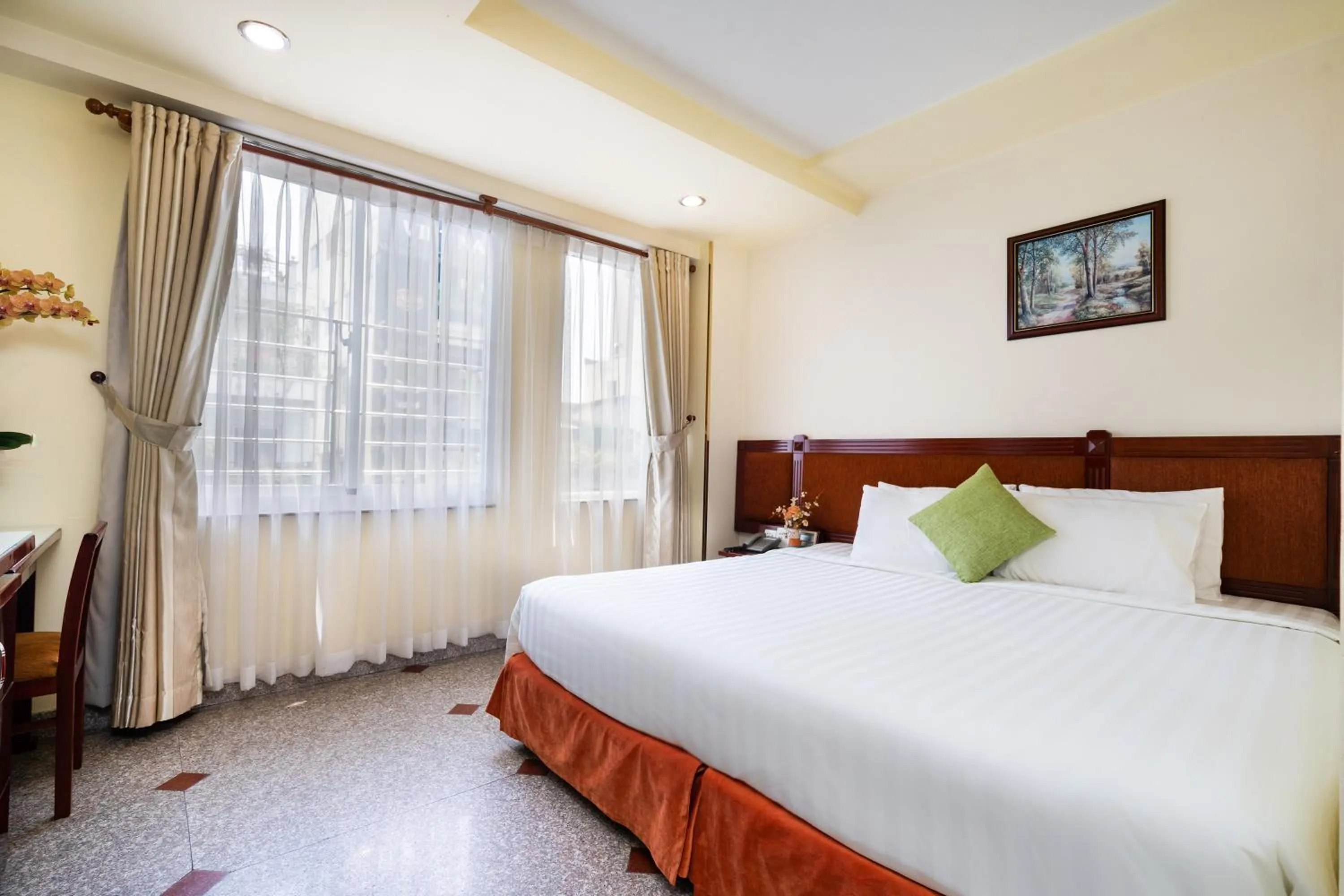 Bed in LUCASTA SAIGON Hotel