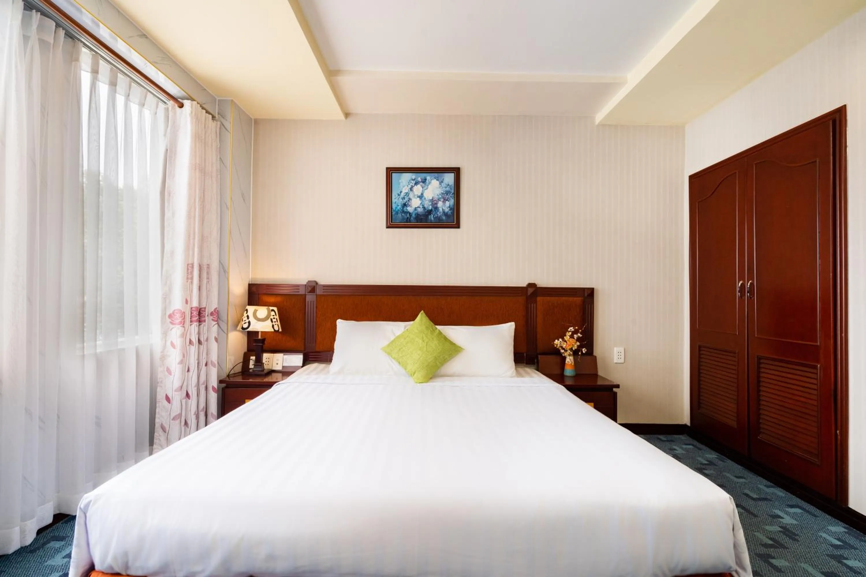 Bed in LUCASTA SAIGON Hotel