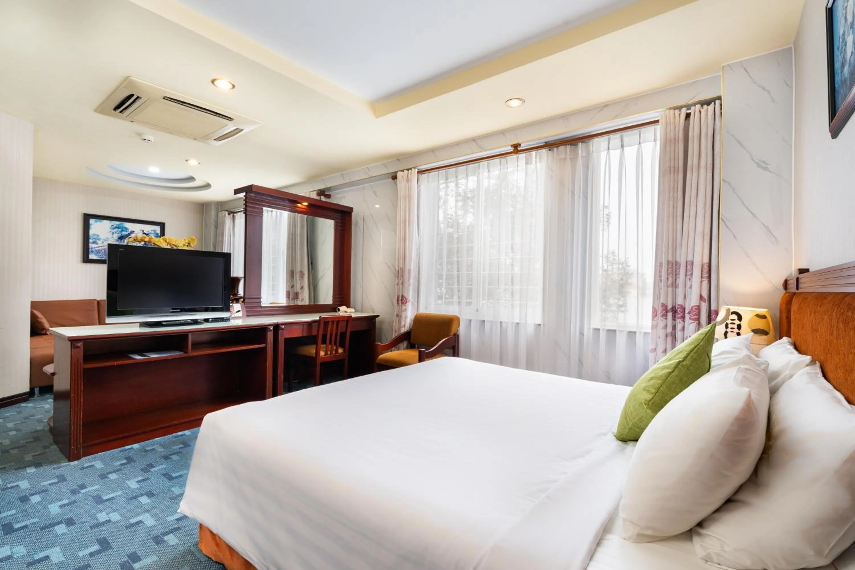 Communal lounge/ TV room, Bed in LUCASTA SAIGON Hotel