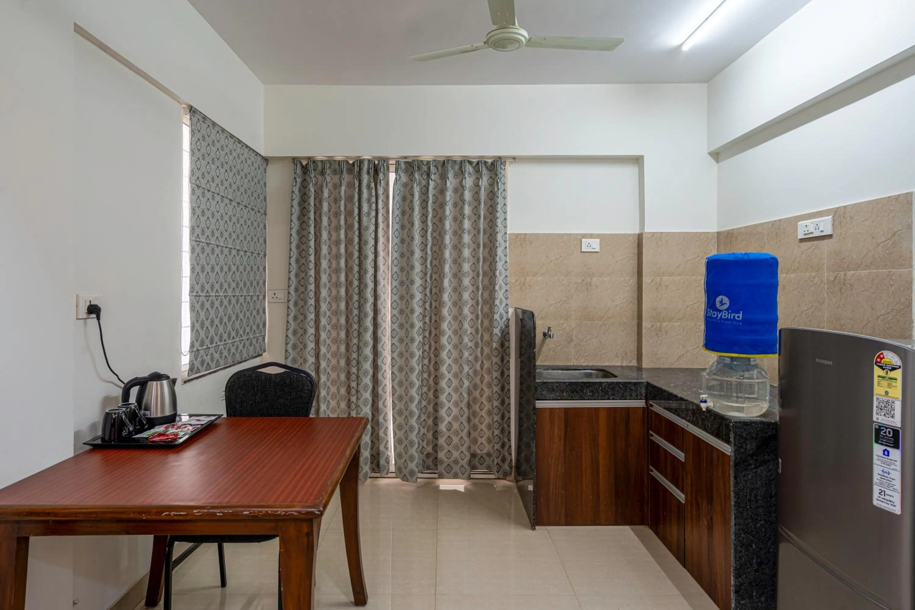 Kitchen or kitchenette in StayBird - Silver Oak, An Apartment Hotel, Kharadi
