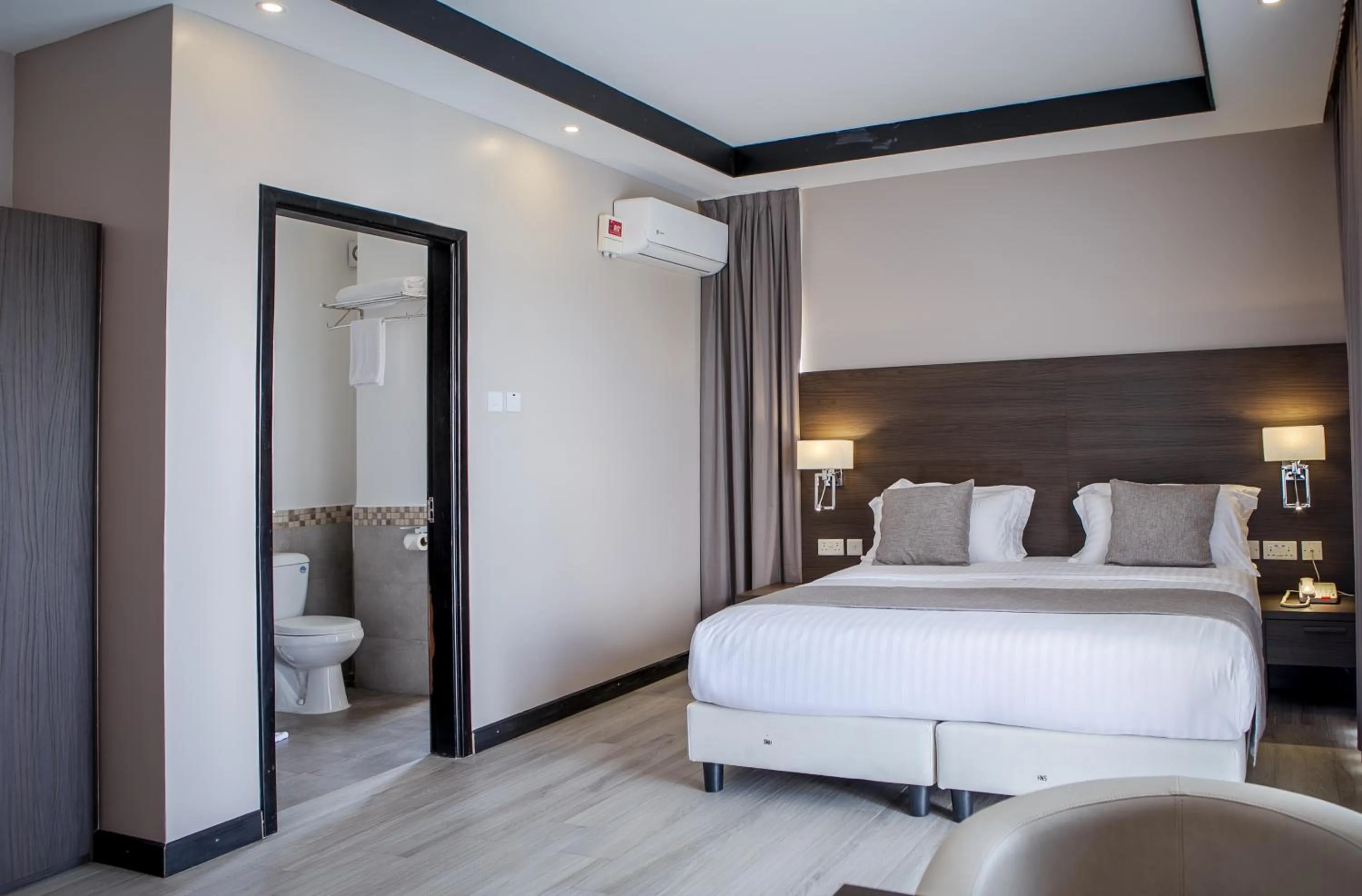 Toilet, Bed in Source of The Nile Hotel- Namanve Branch