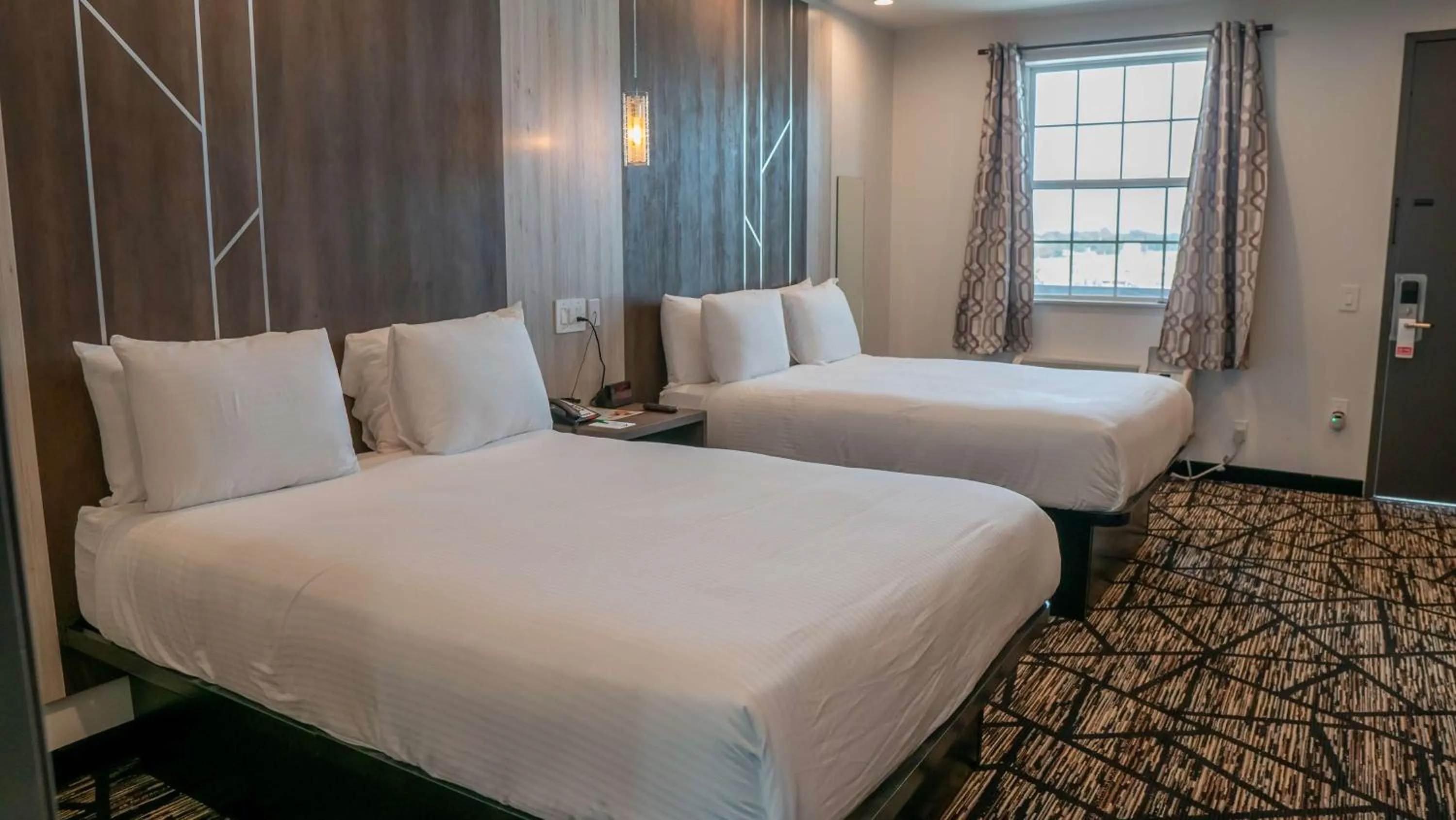 Bedroom, Bed in Comfeeni Inn and Suites