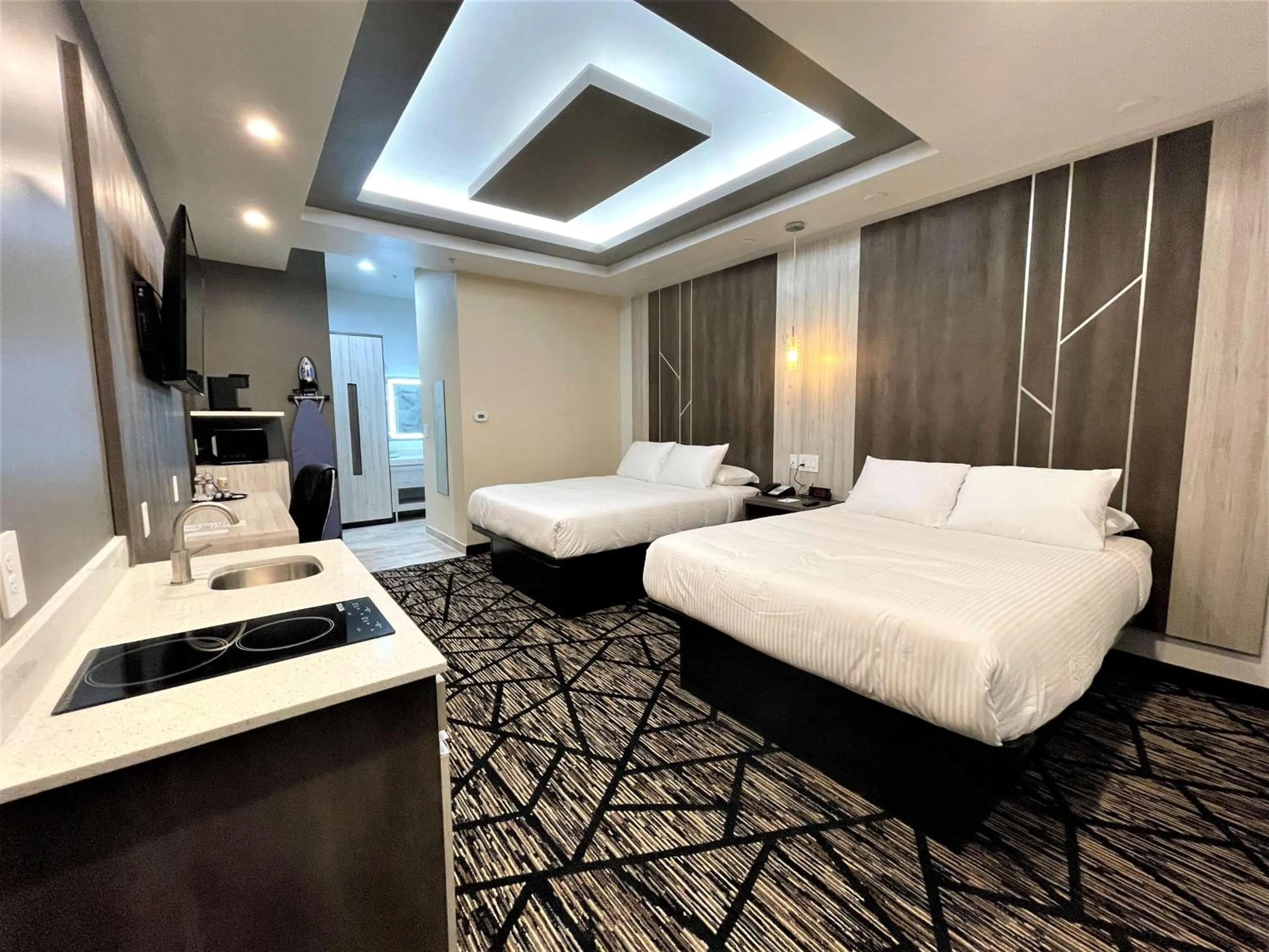 Queen Room with Two Queen Beds and Kitchenette - Non-Smoking in SureStay Hotel by Best Western Houston Southeast