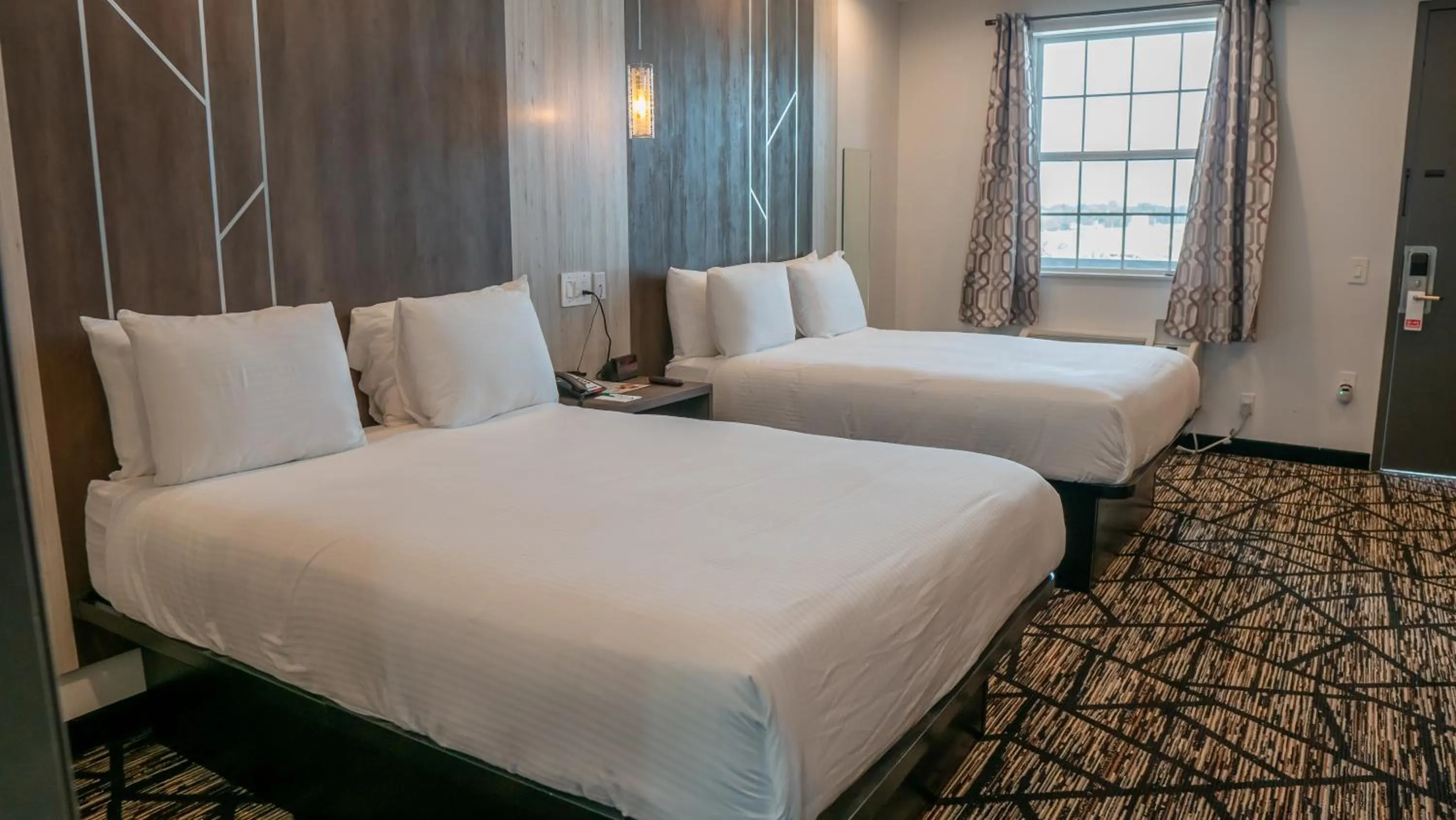 Bedroom, Bed in Comfeeni Inn and Suites