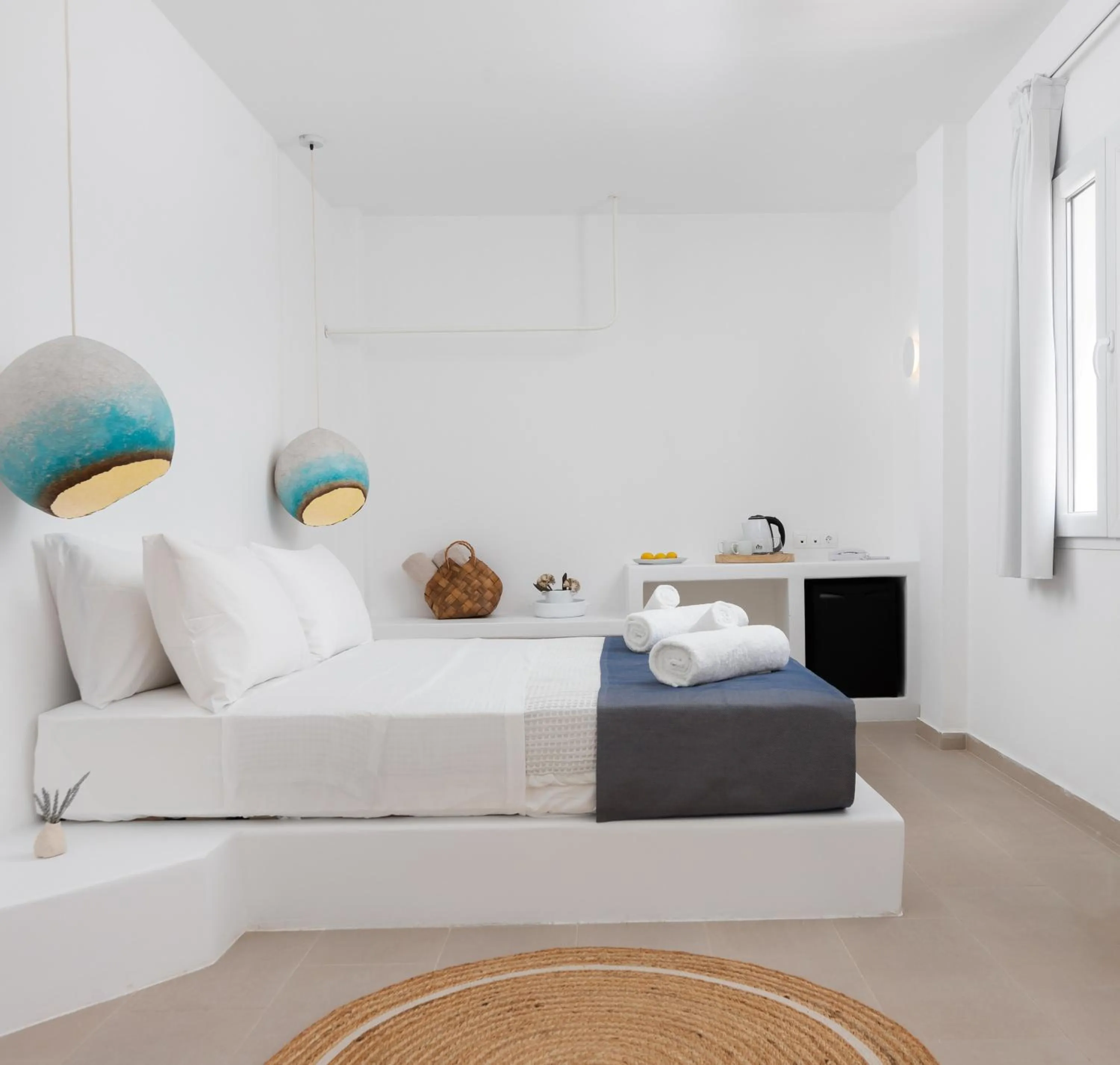 Bed in VOCA HOTEL & SUITES