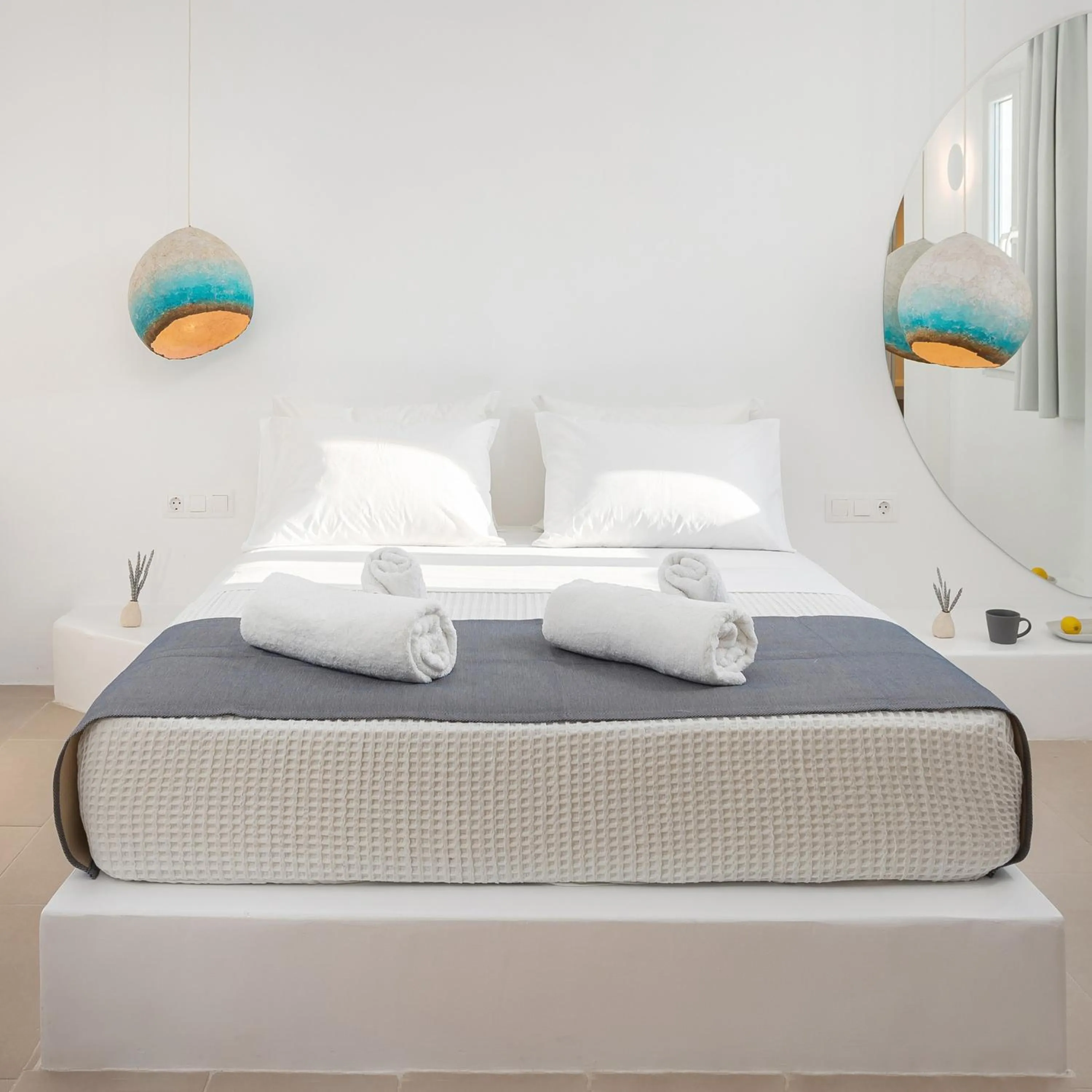 Bed in VOCA HOTEL & SUITES