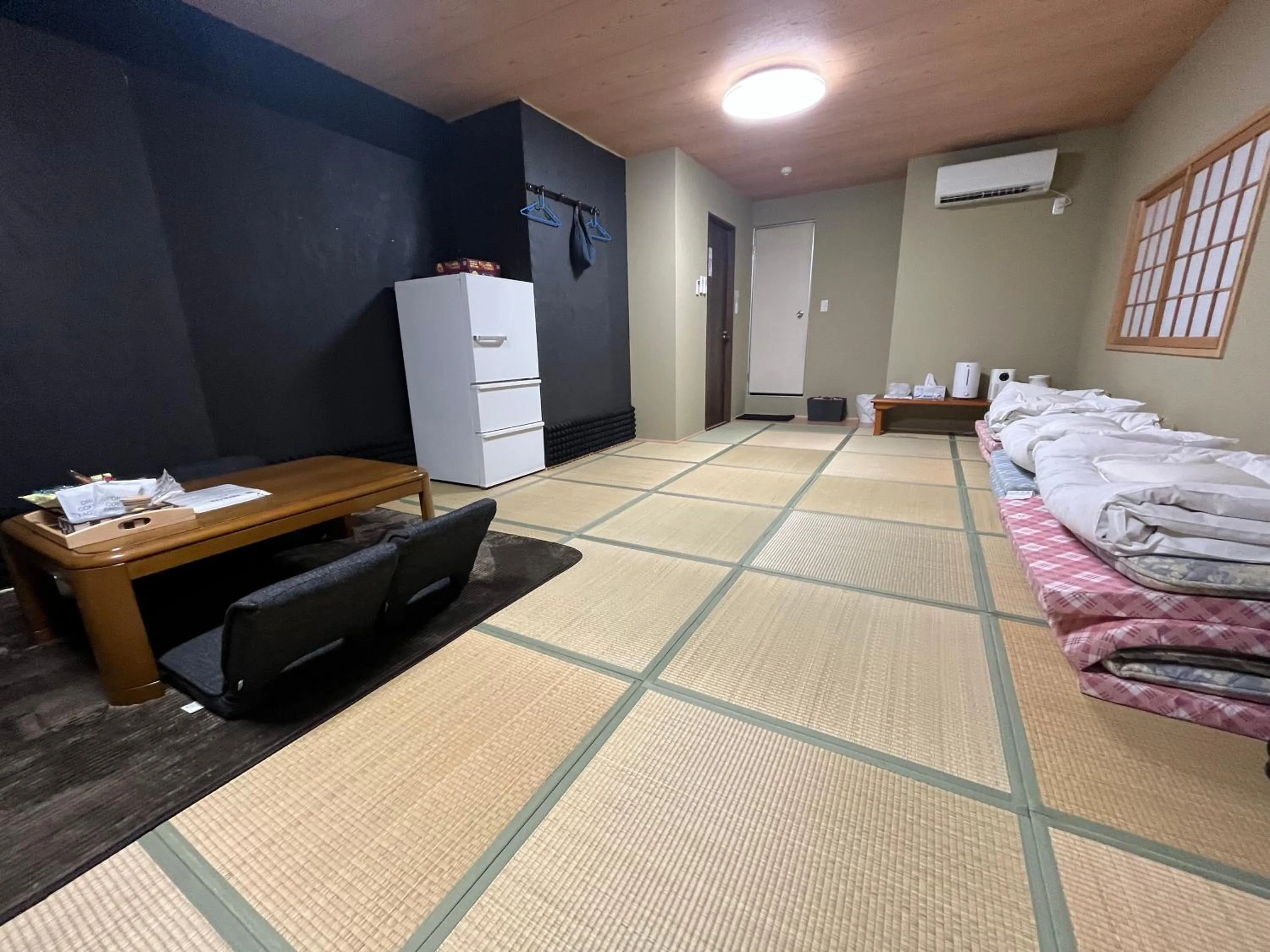 Bed in Wafu Ryokan Uehonmachi