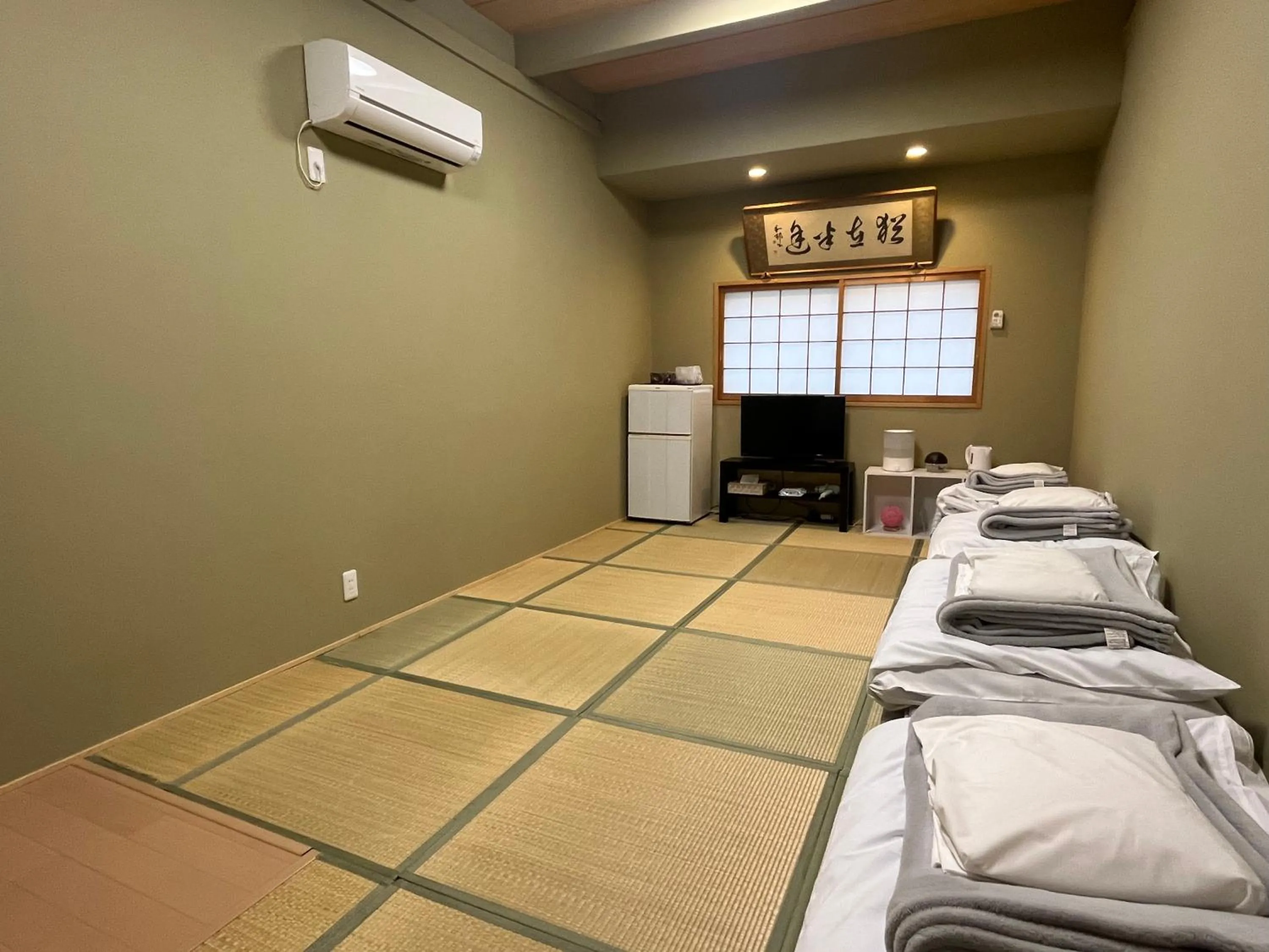 Bed in Wafu Ryokan Uehonmachi