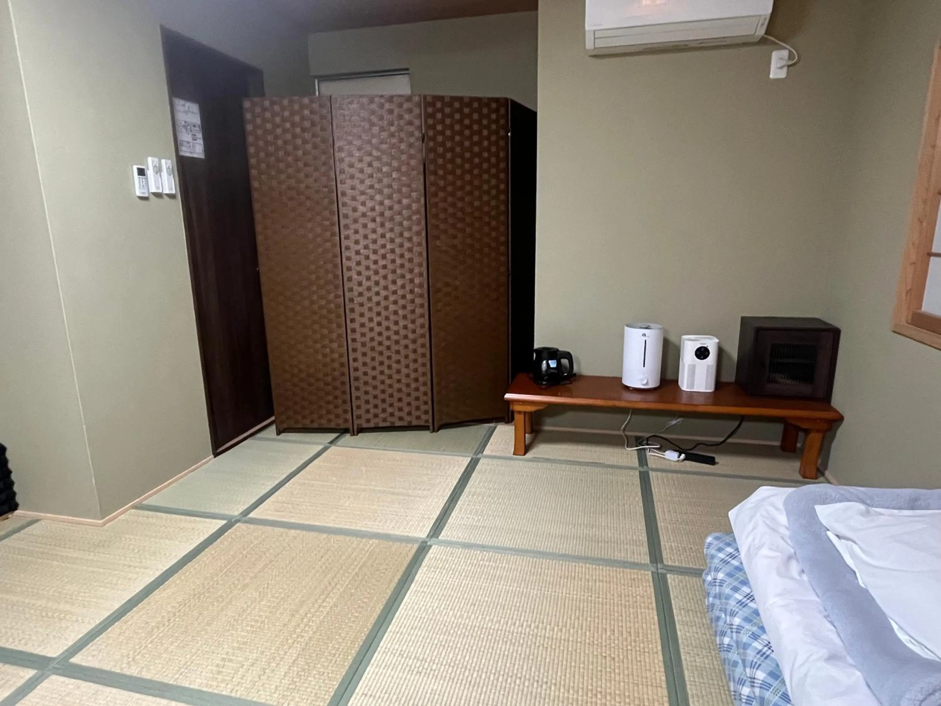 Bed in Wafu Ryokan Uehonmachi