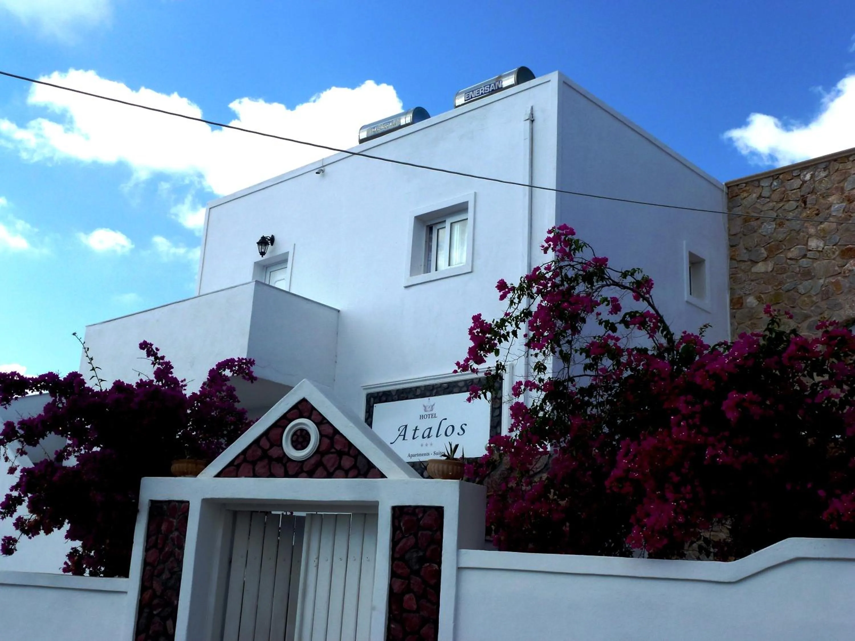 Property logo or sign in Atalos Suites